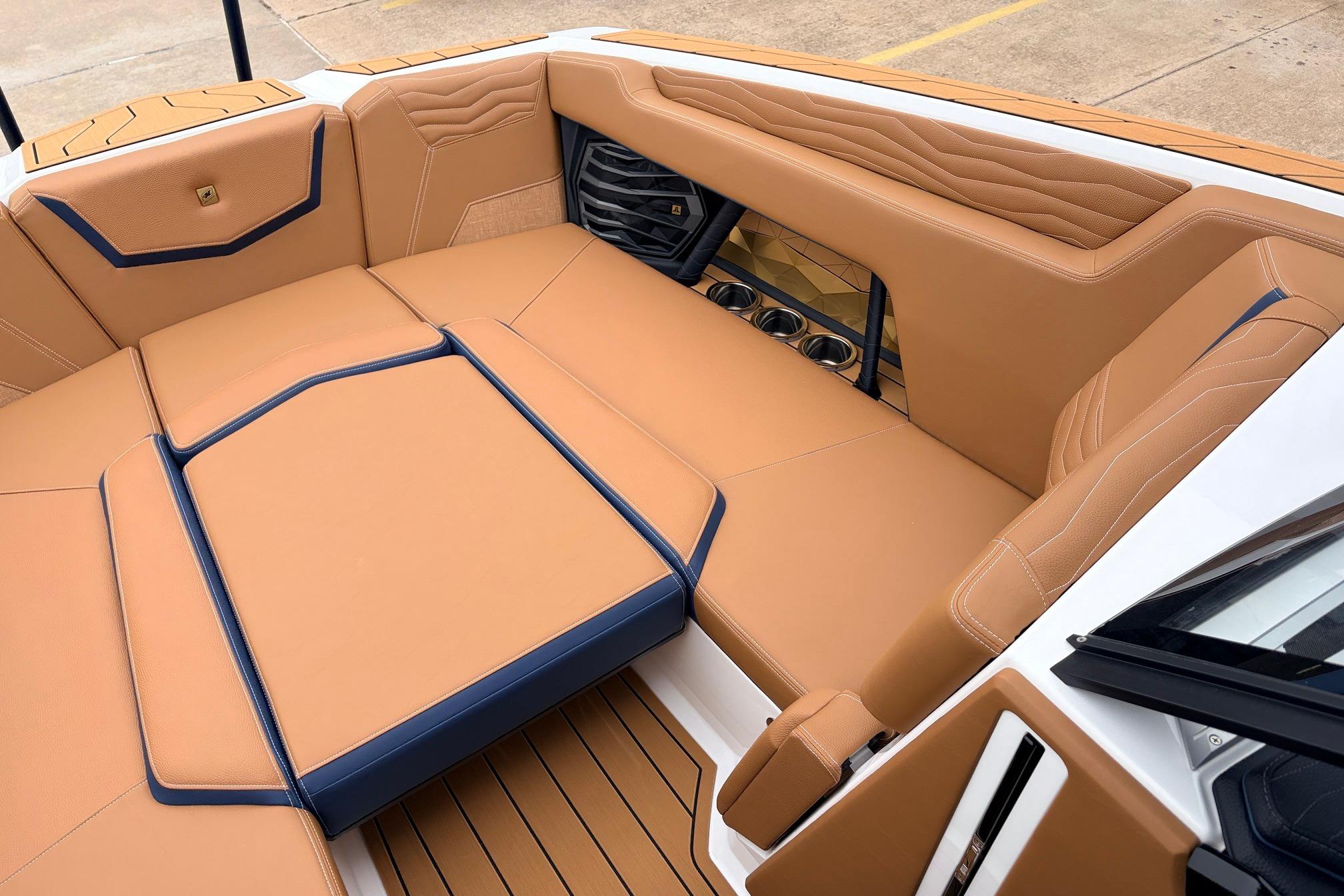 Luxurious interior of 2026 Nautique Super Air Nautique G25 boat with tan upholstery.