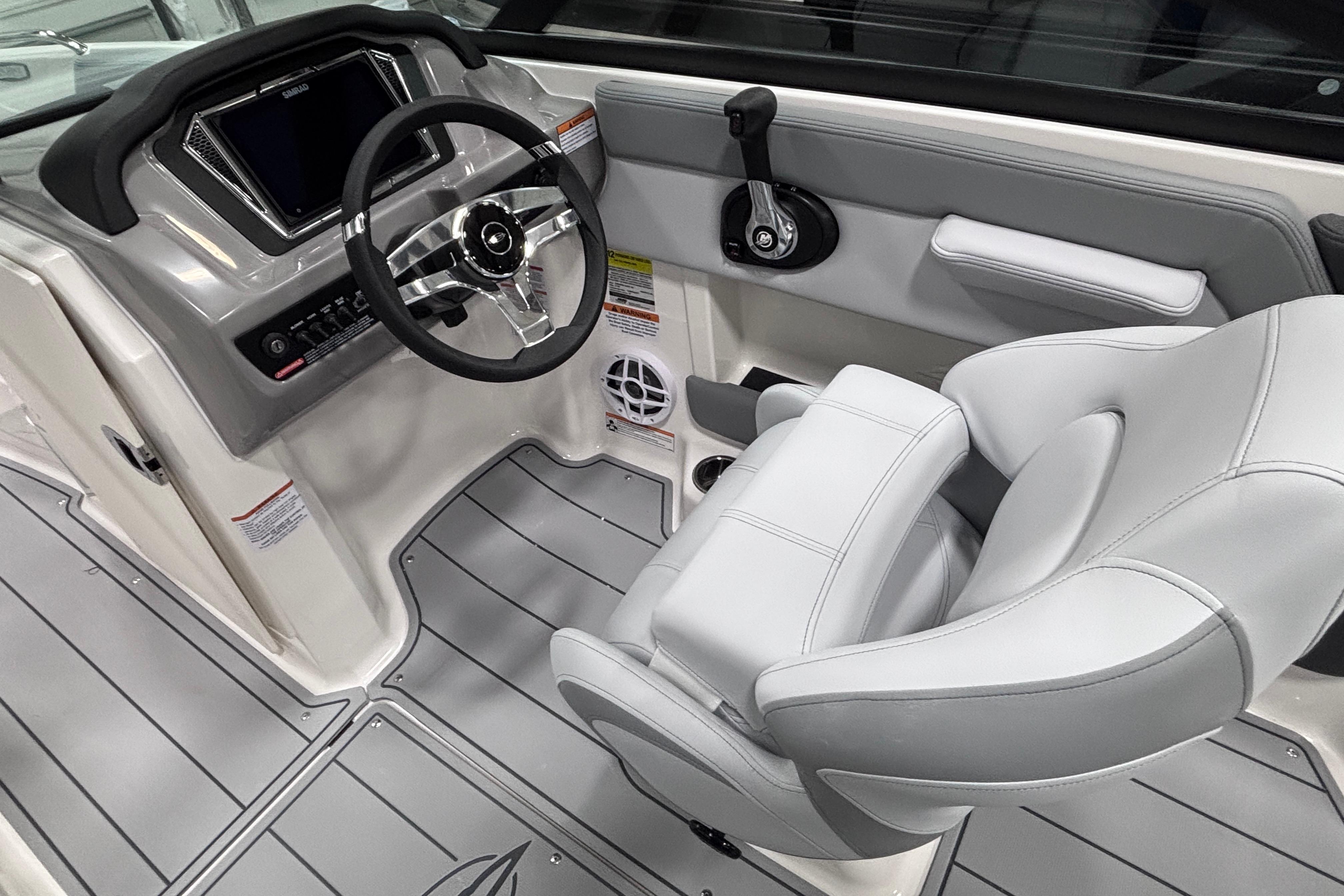 2026 Chaparral 21 SSi boat interior with modern steering and controls.