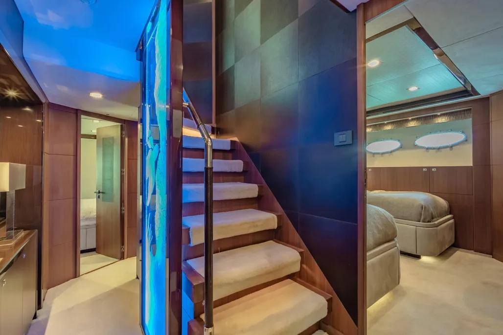 Luxurious interior of 2013 Princess M Class 32M yacht with elegant staircase and modern design.