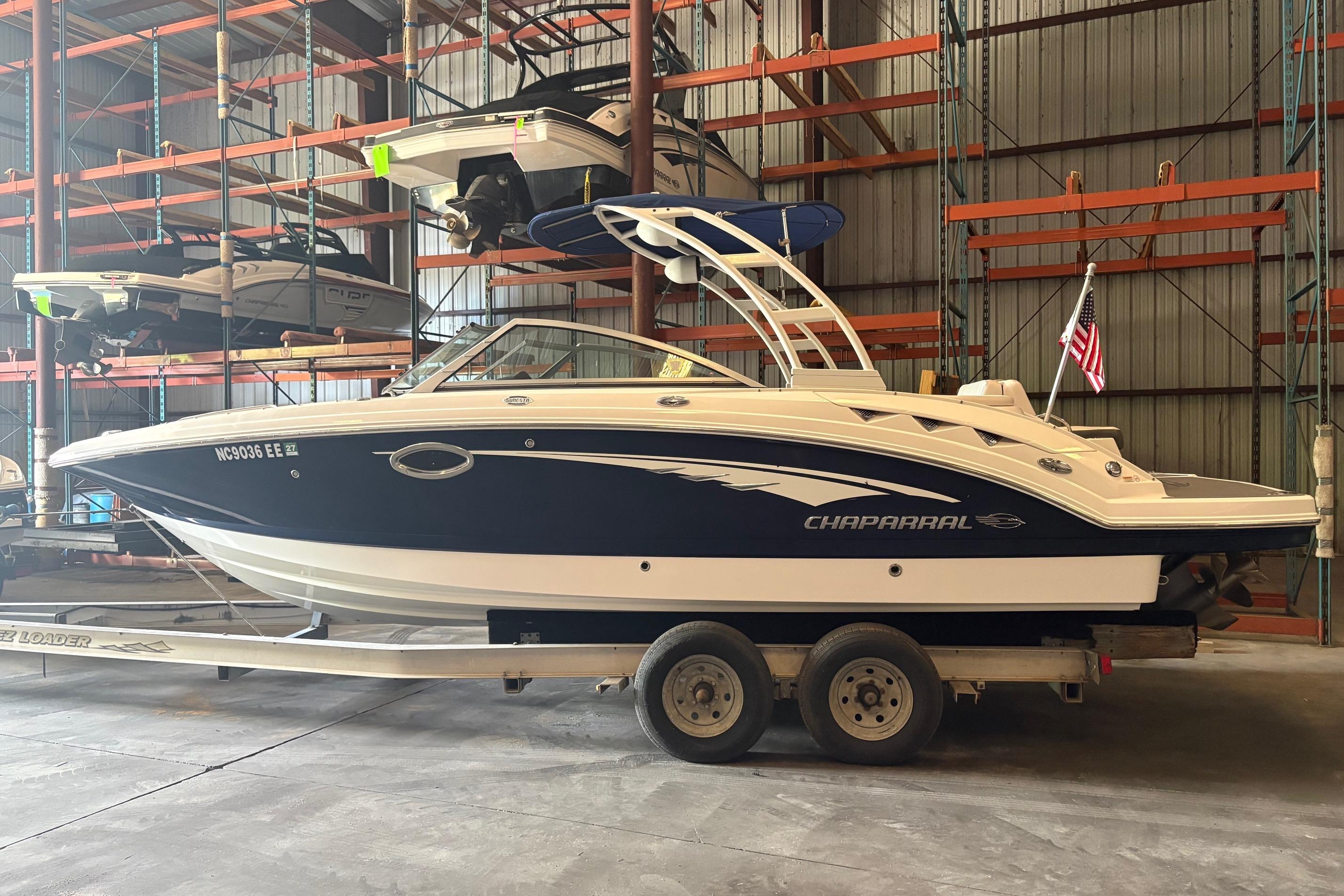 2016 Chaparral 244 Sunesta boat on trailer in storage facility.