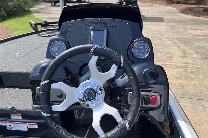 Steering console of a 2026 Nitro Z17 boat with gauges and controls.