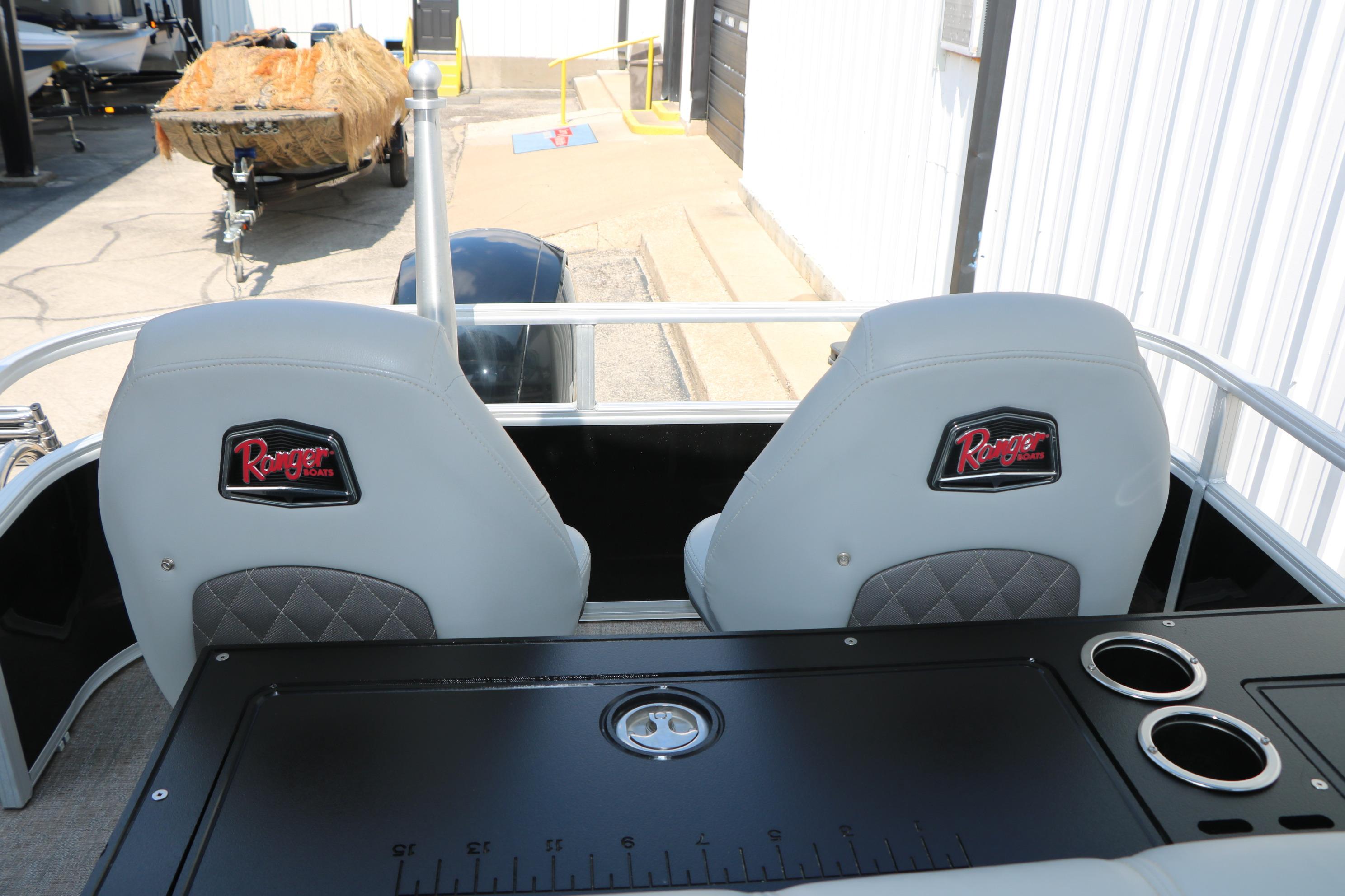 2021 Ranger 223FC boat seats with logo, featuring cup holders and a measuring board.