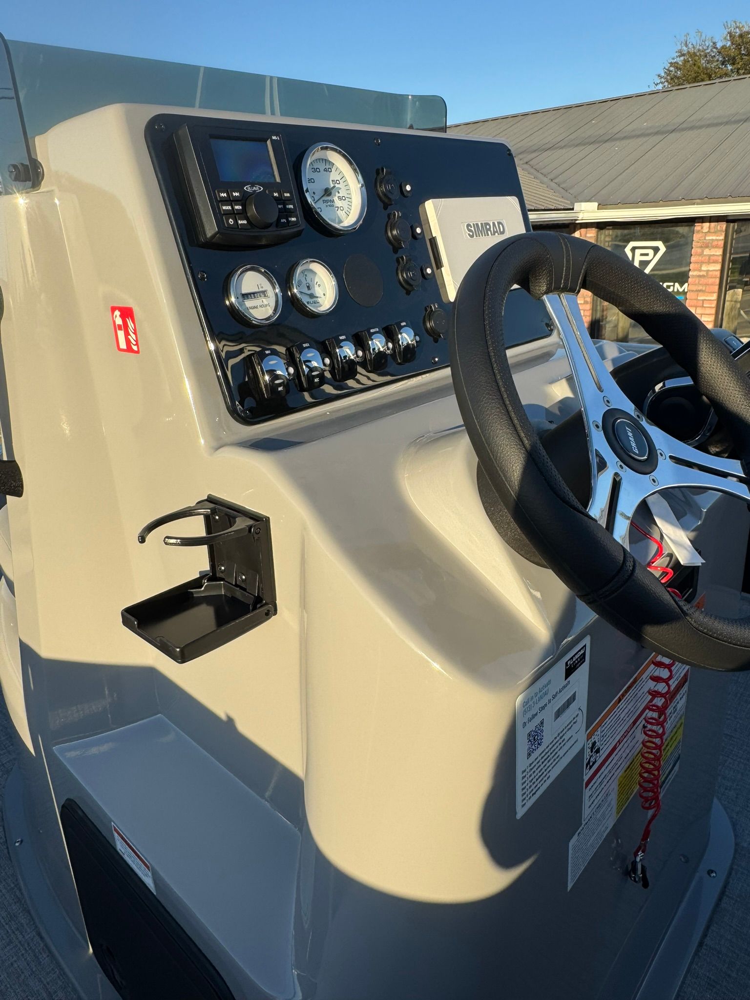 2026 Landau Alure 21CC Fish helm with gauges and controls.