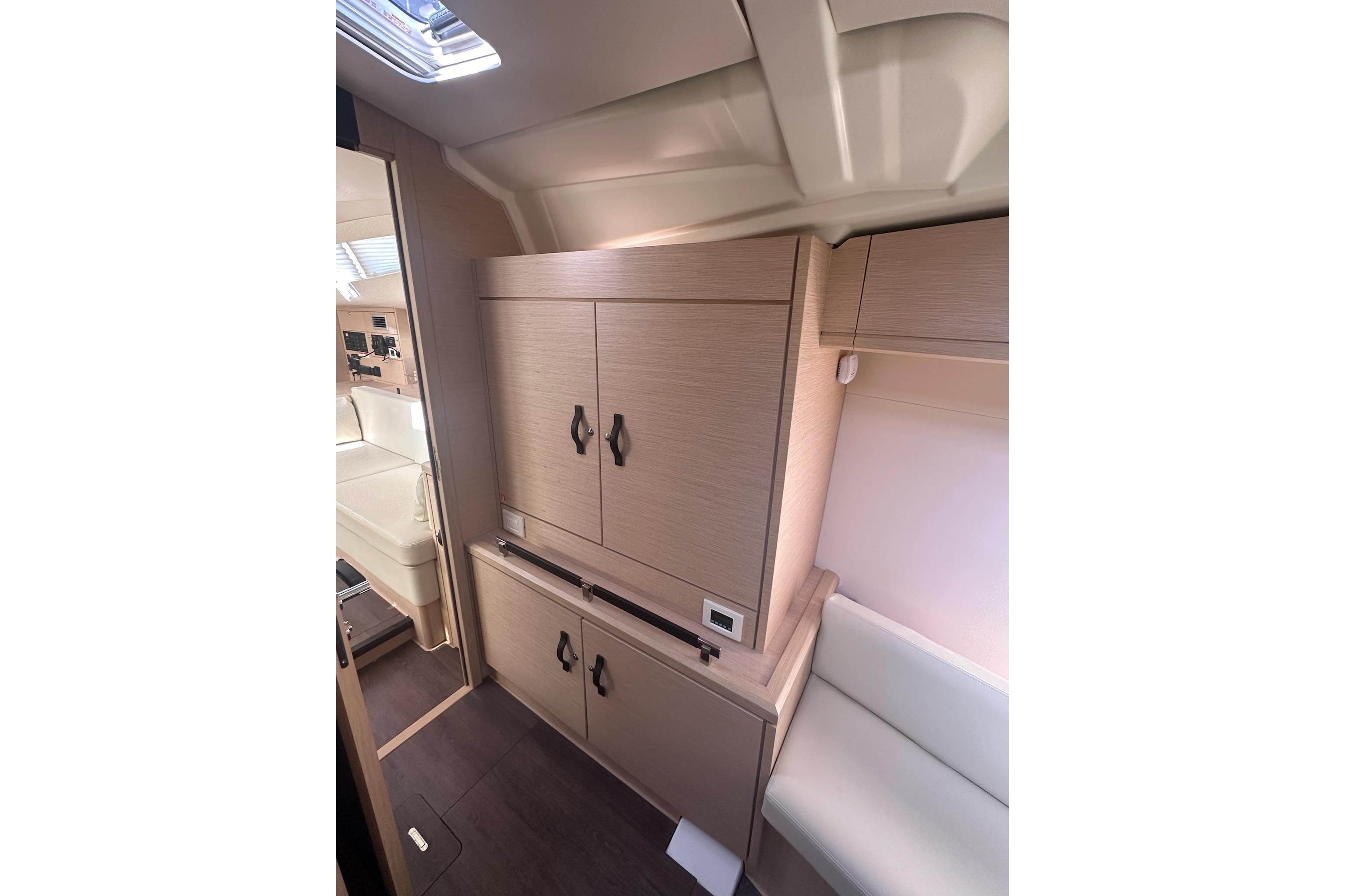 Interior of 2018 Jeanneau 51 yacht featuring modern cabinetry and seating.