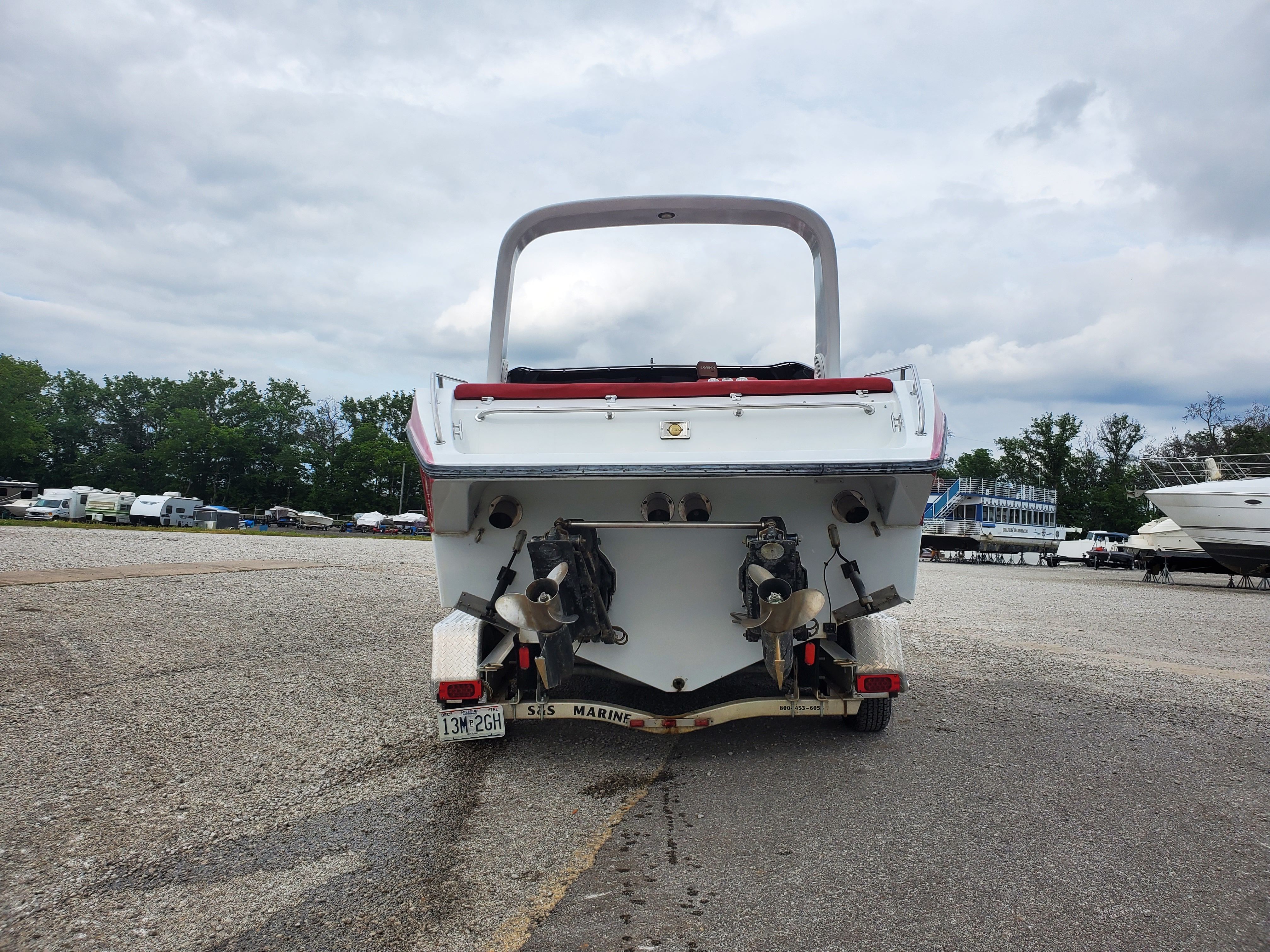 Rear view of a 1989 Baja 280 Sport boat on a trailer.
