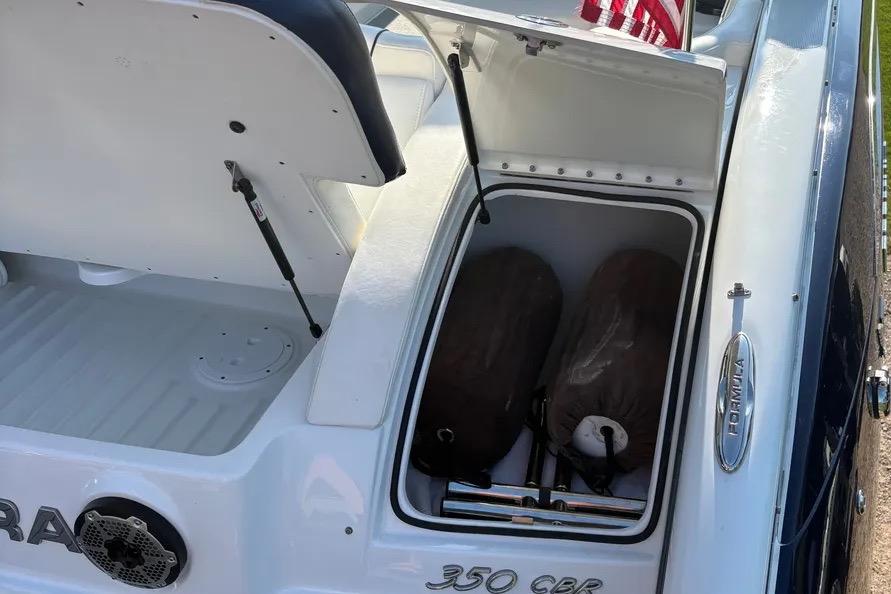 2015 Formula 350 Crossover Bowrider storage compartment with open hatch and visible equipment.