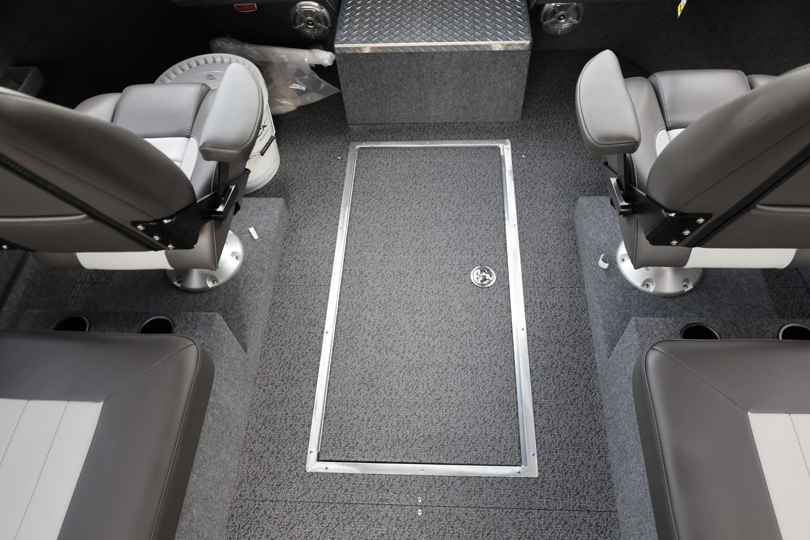Interior of 2026 Thunder Jet 24 Alexis Pro boat with seating and storage.