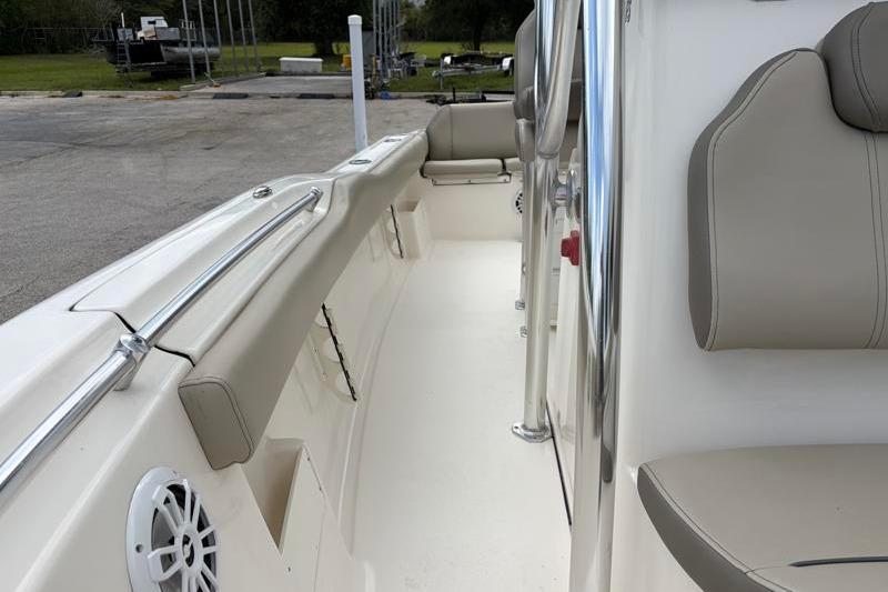2024 Key West 239 FS boat interior with beige seating and stainless steel railings.