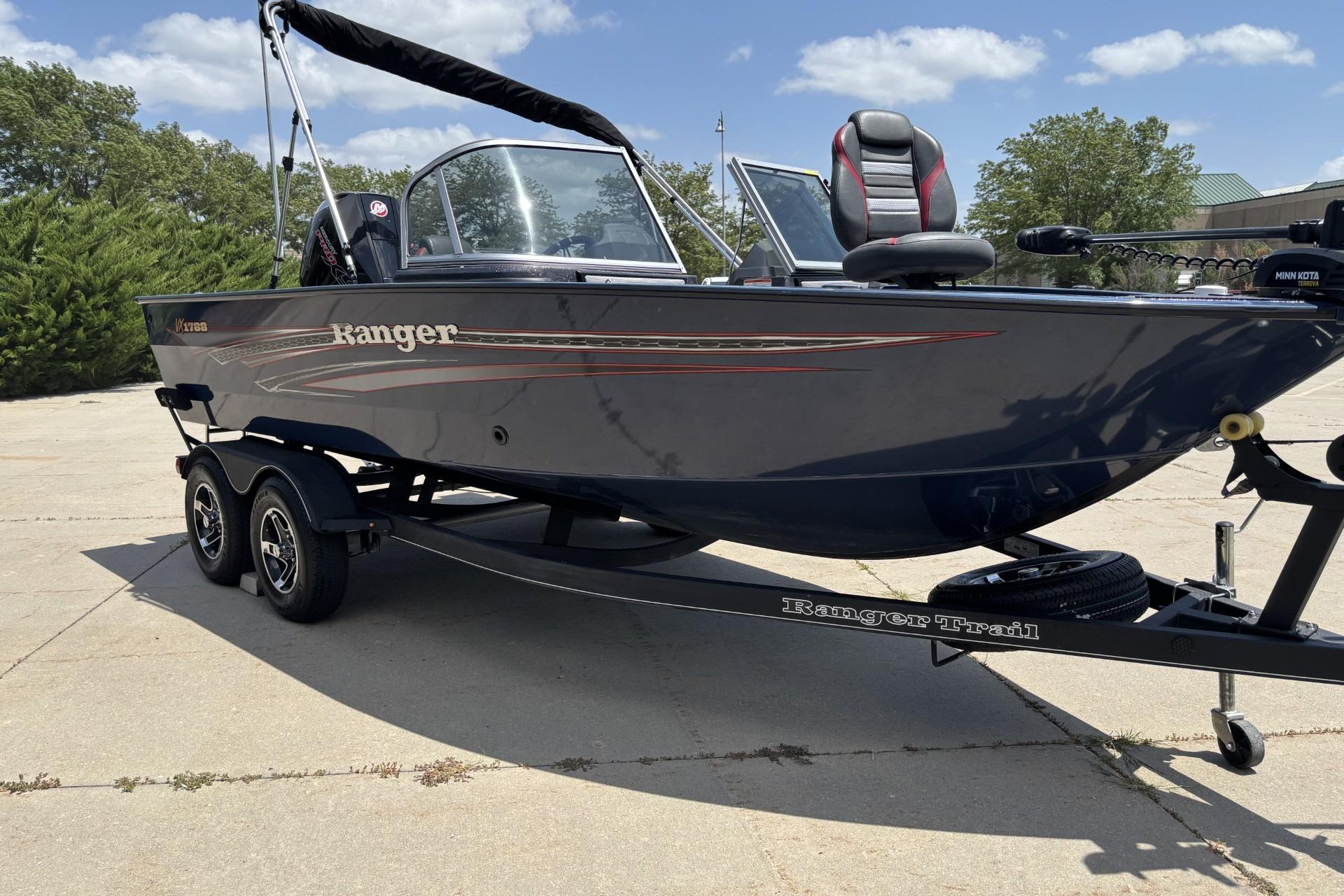 2021 Ranger VX1788 WT boat on trailer, parked outdoors under a clear sky.