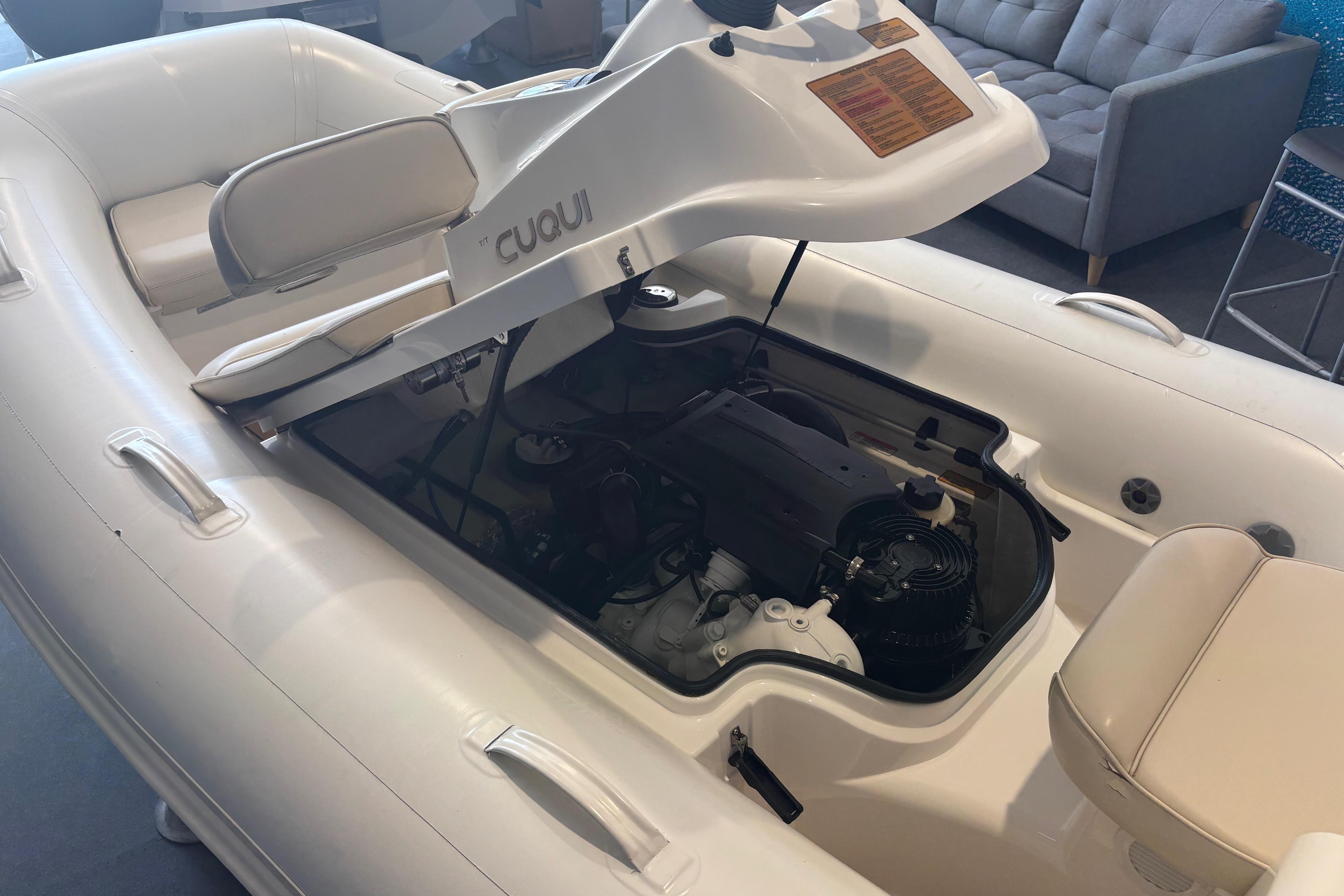 2014 Williams Jet Tenders Turbojet 325 with open engine compartment, showcasing interior details.