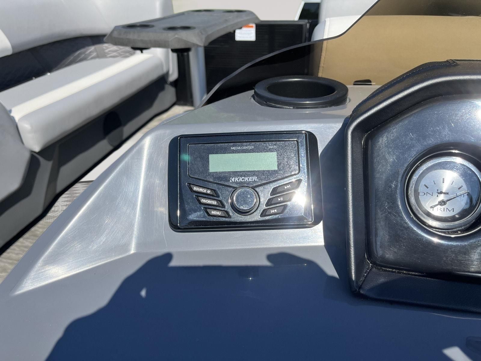 The image shows the dashboard of a 2025 Bennington S20 boat with a Kicker audio system.