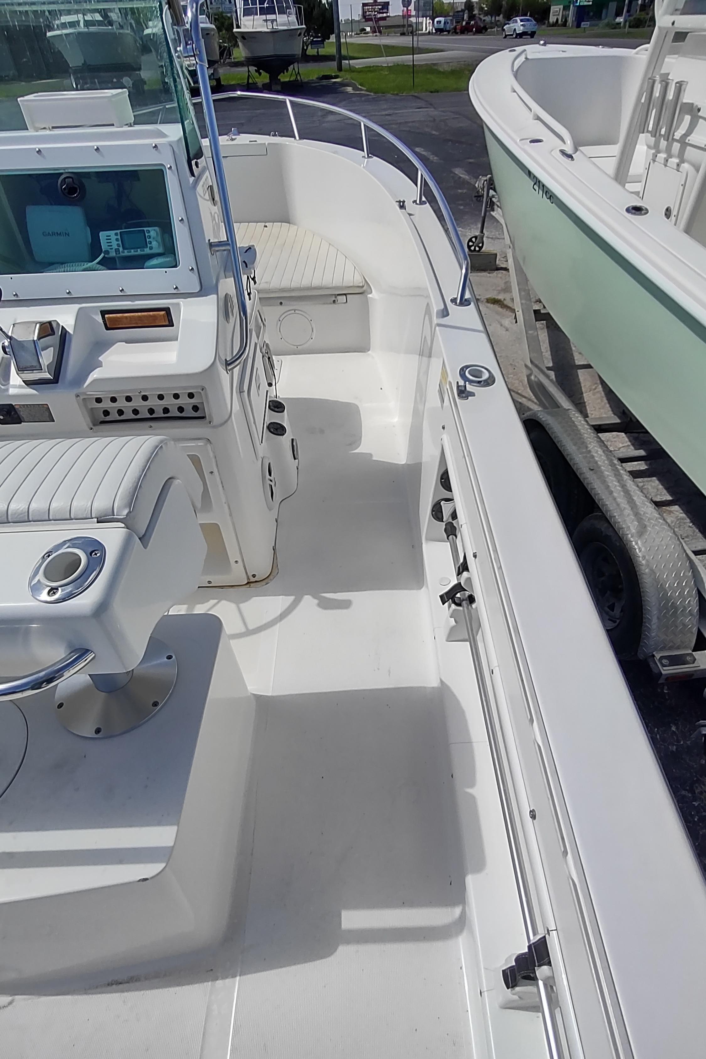 2001 Robalo Center Console boat interior with seating and control panel.