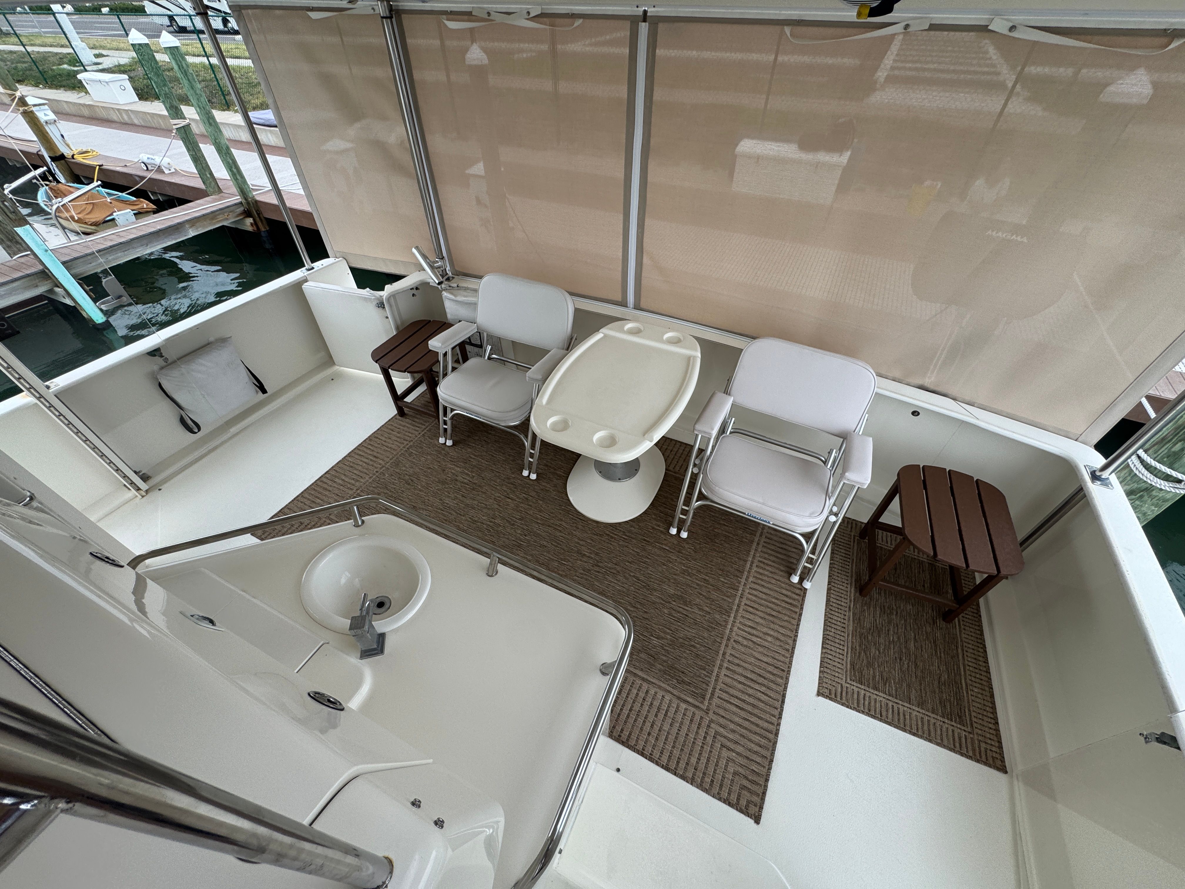 2001 Sea Ray 380 Aft Cabin with cozy seating area and table.