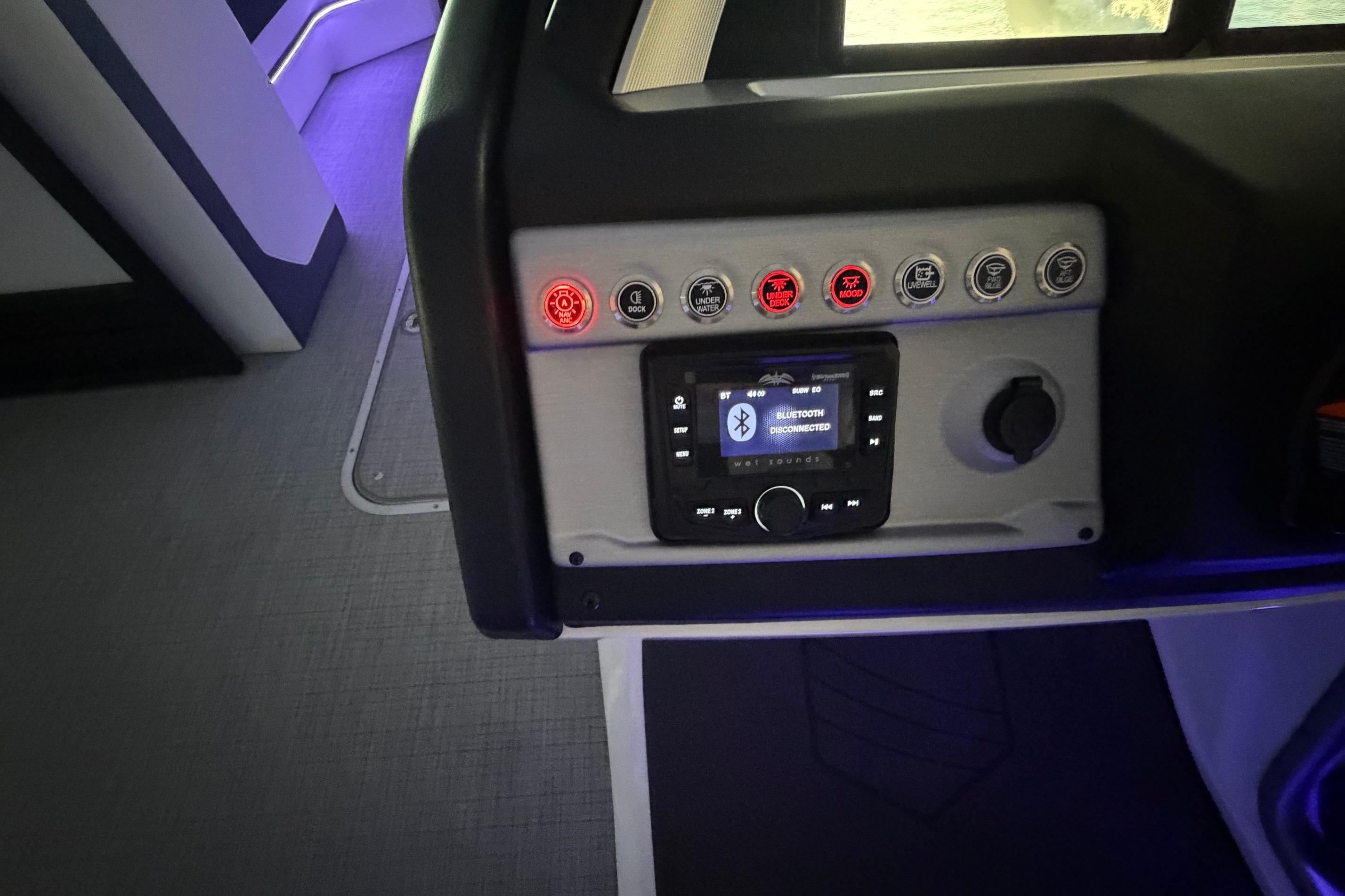 Control panel of 2026 South Bay 525SB2 boat with Bluetooth connectivity and illuminated buttons.