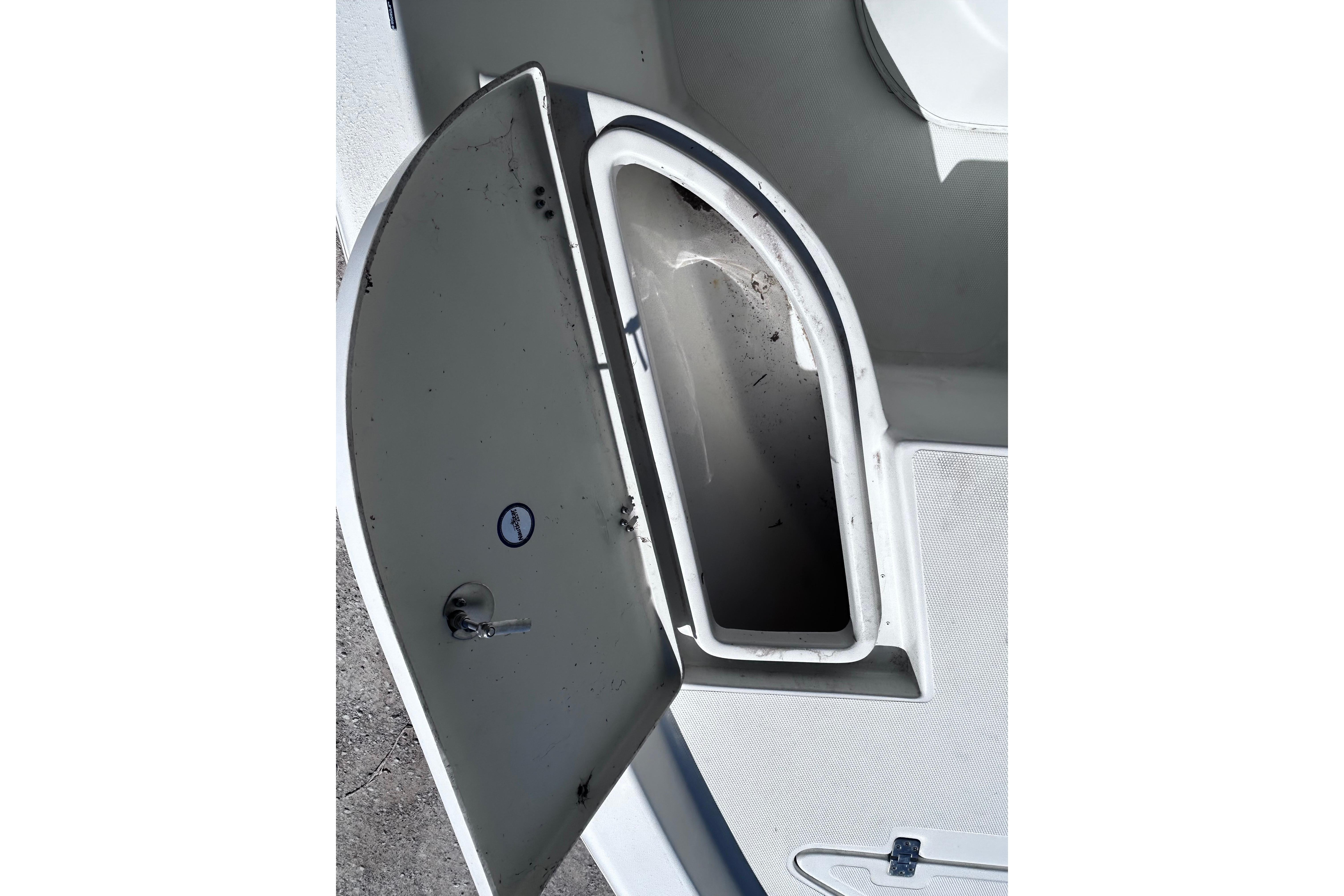 Open storage compartment on a 2016 NauticStar 1810 NauticBay boat.