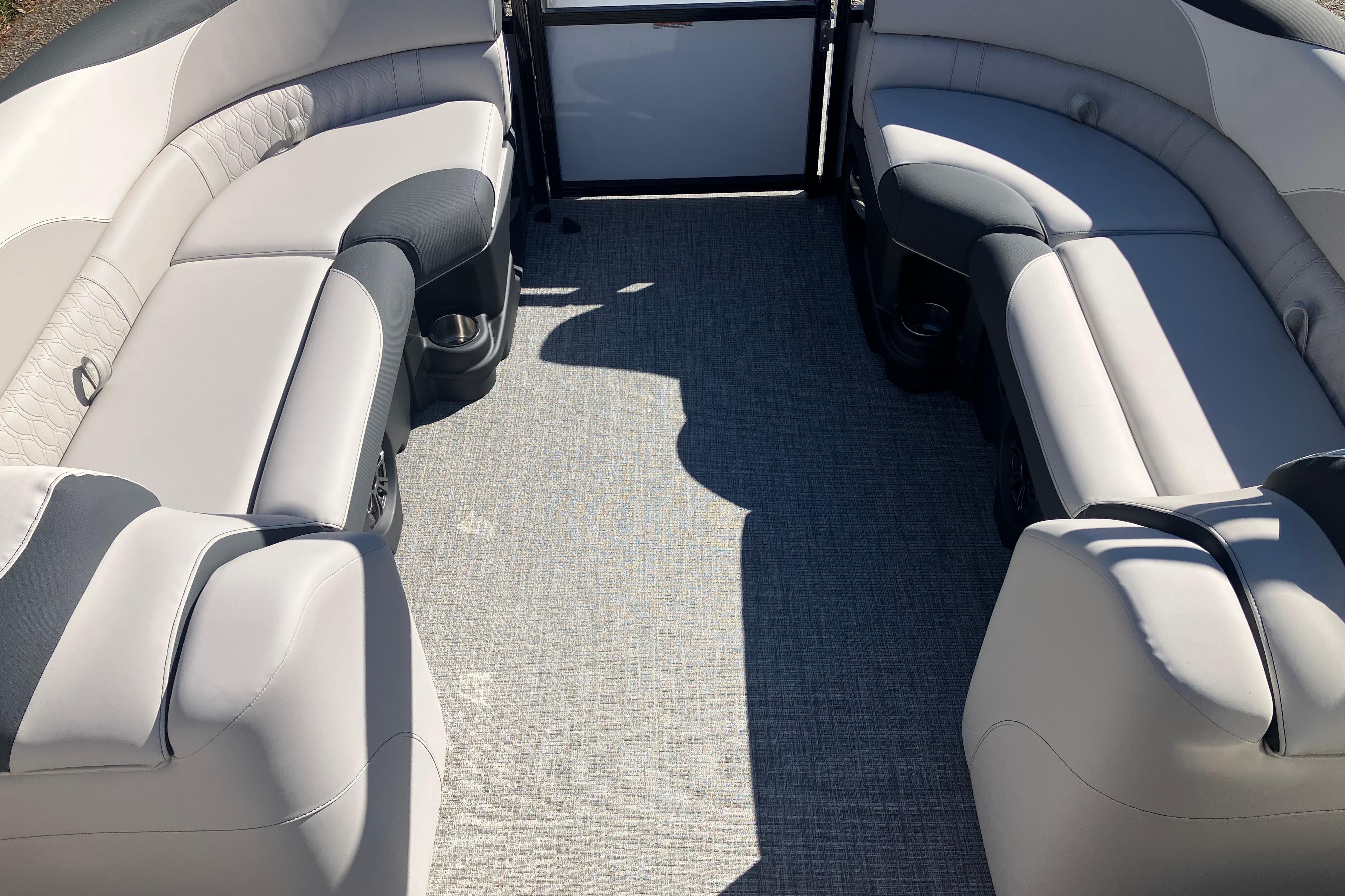 2026 Tahoe Pontoon LTZ Quad Lounger interior with luxurious seating and modern design.