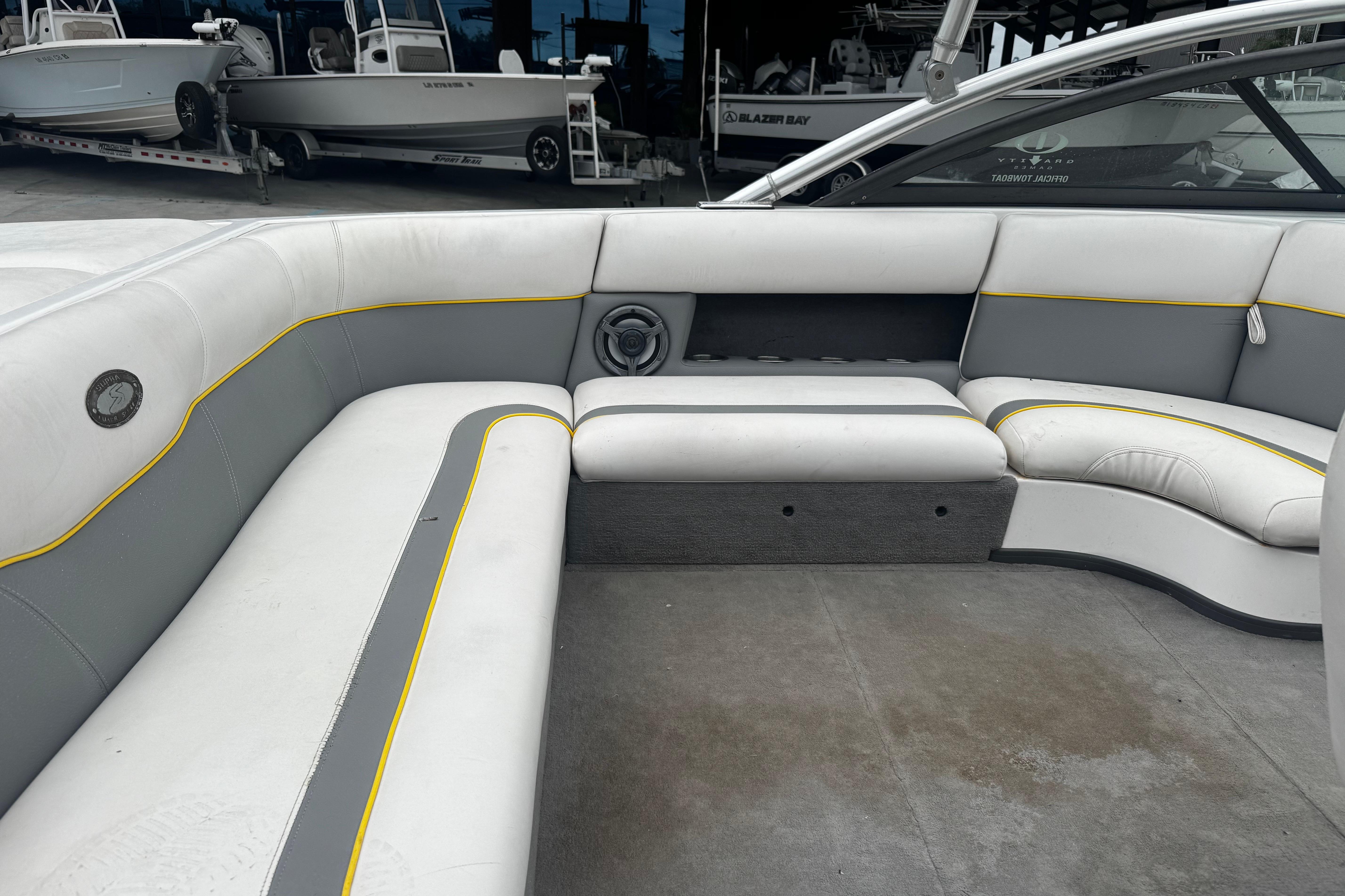 2006 Supra Launch 22 SSV boat interior with white and gray seating.