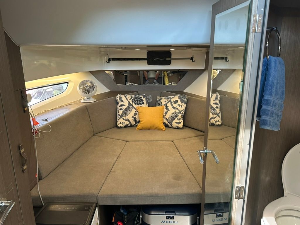 Interior of 2024 Beneteau Gran Turismo 32 with cozy seating area.