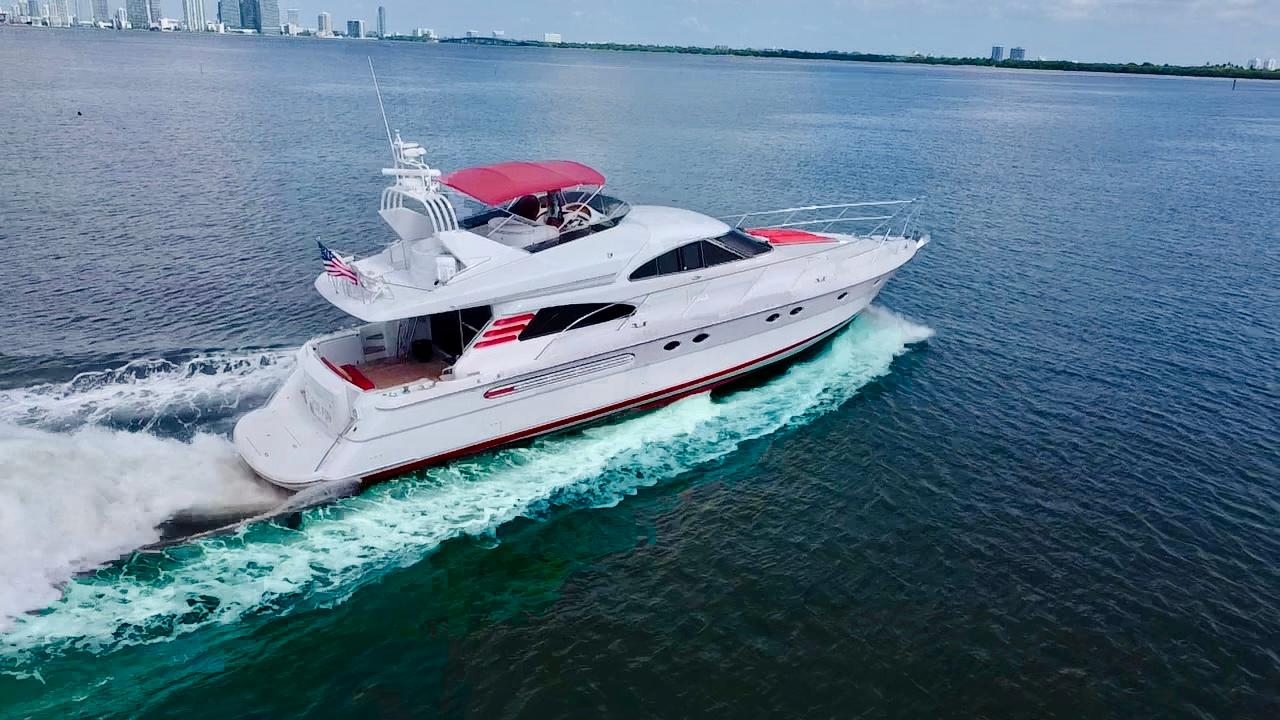 1999 Fairline Squadron 65 yacht cruising on open water.