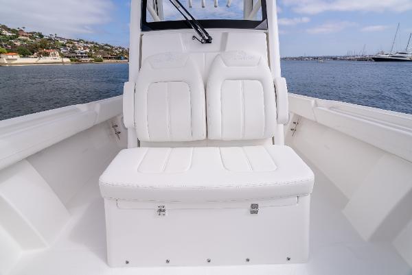 2025 Regulator 28 boat with white seating area on calm waters.