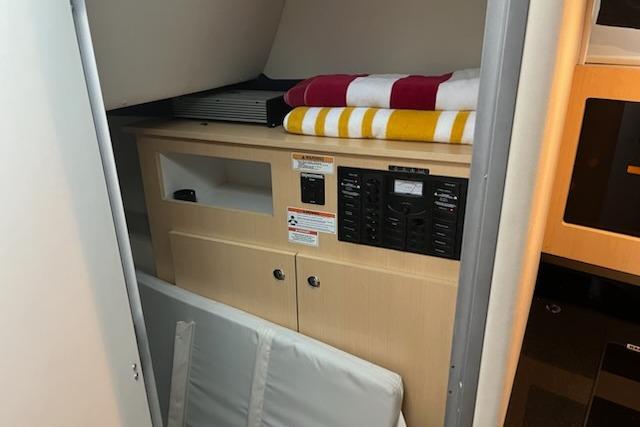 Interior view of a 2012 Bayliner 285 Cruiser, featuring control panels and storage.