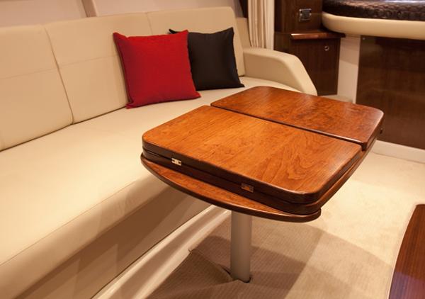 Manufacturer Provided Image: Interior of 2013 Four Winns Vista 375 with wooden table and beige seating.
