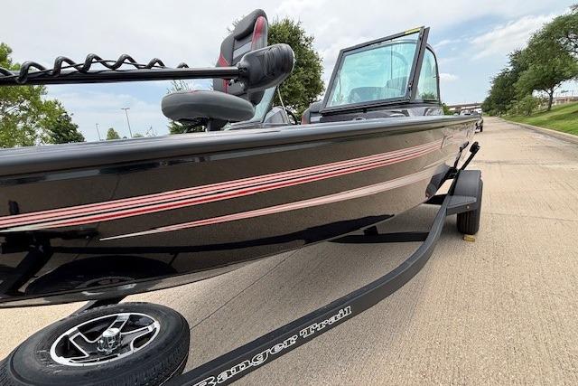 2026 Ranger VS1782SC Angler boat on trailer, sleek black design with red accents.