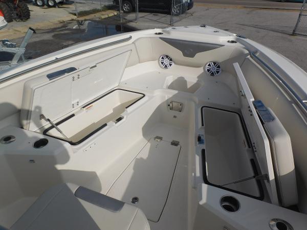 2025 Sailfish 232 CC boat interior with open storage compartments and speakers.