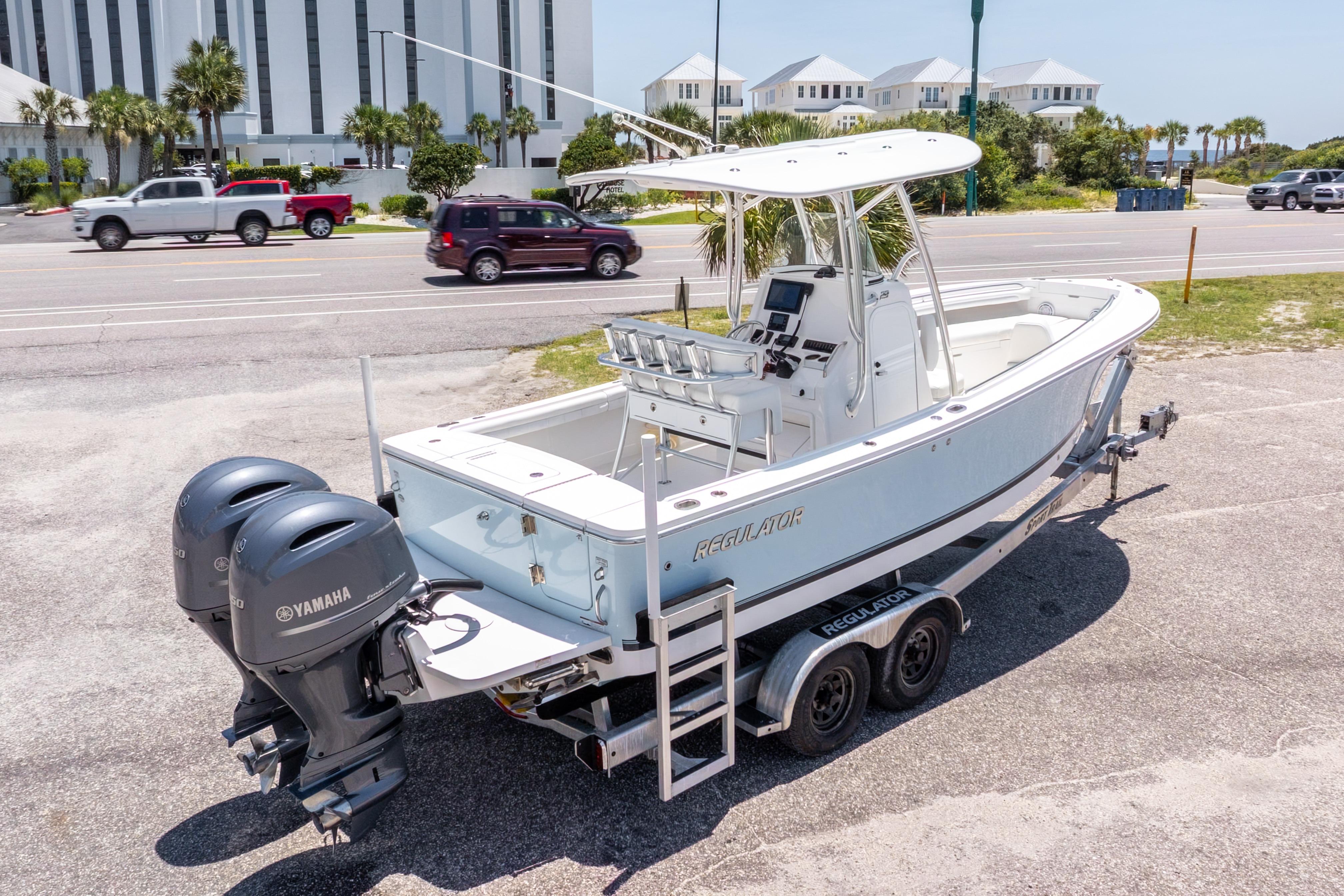 2019 Regulator 23 Center Console boat with dual Yamaha engines on a trailer.