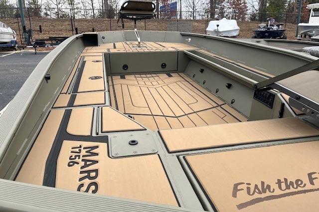 2026 Tracker Grizzly 1756 T Marsh boat interior with custom flooring and storage compartments.