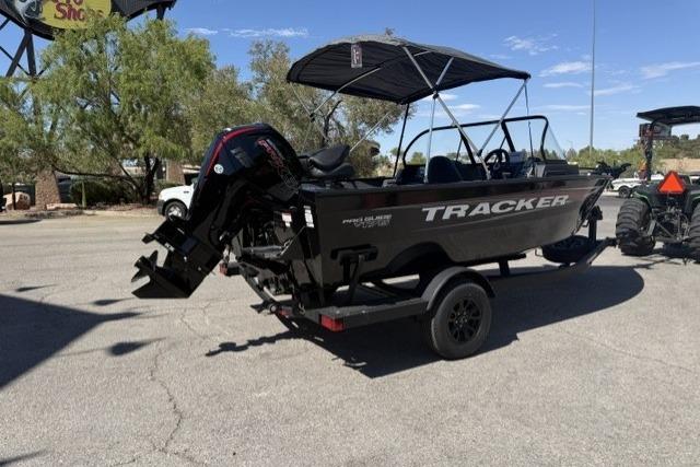 2026 Tracker Pro Guide V-175 Combo boat on trailer, parked outdoors.