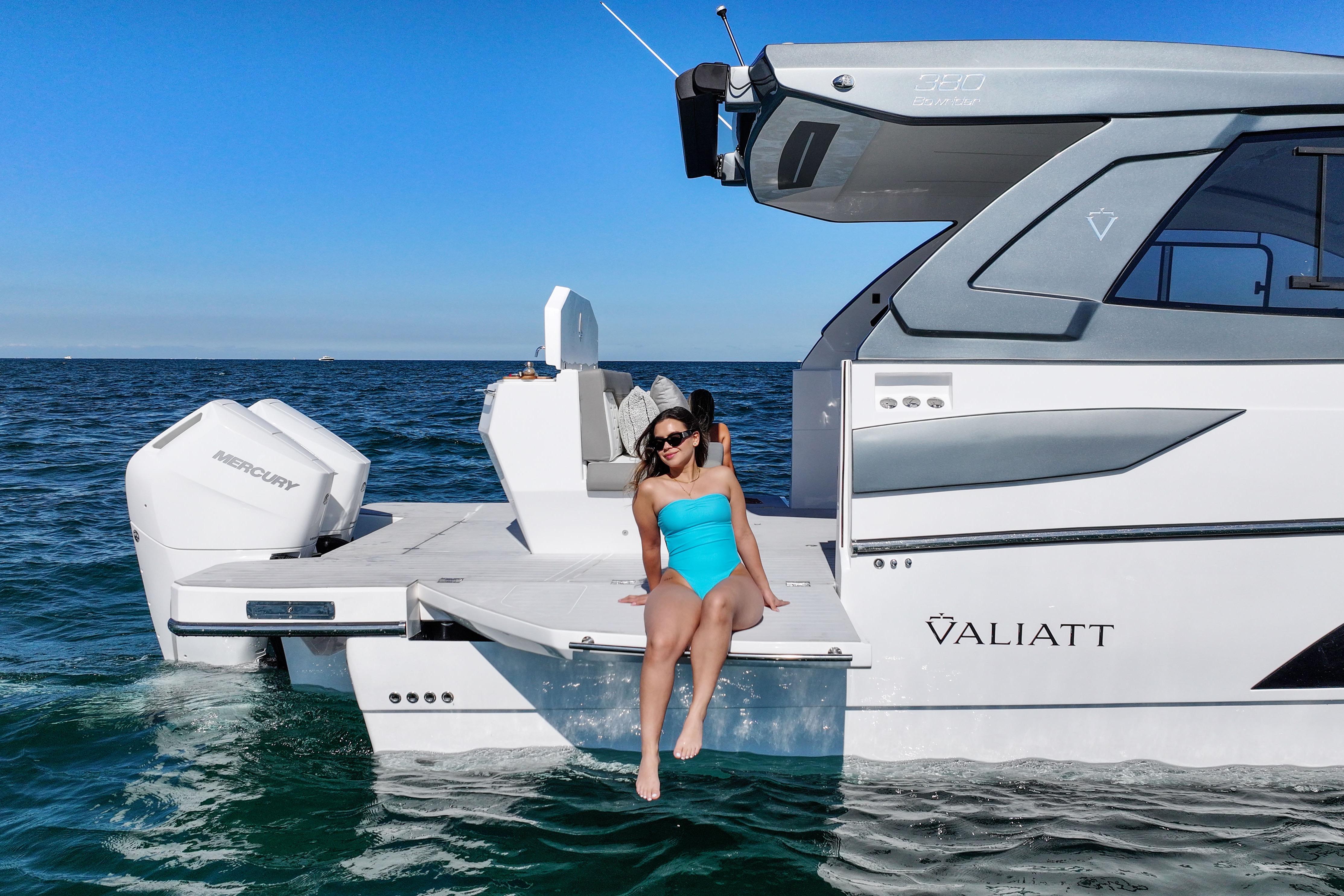 Woman relaxing on a 2025 VALIATT YACHTS 380 Bowrider in open water.