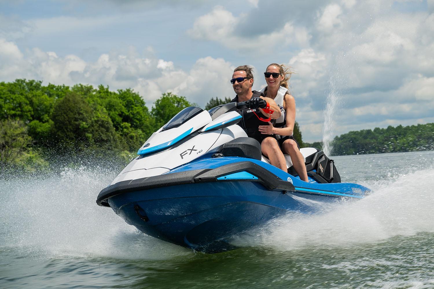 Manufacturer Provided Image: 2026 Yamaha WaveRunner FX HO jet ski on a lake with two riders enjoying the ride.
