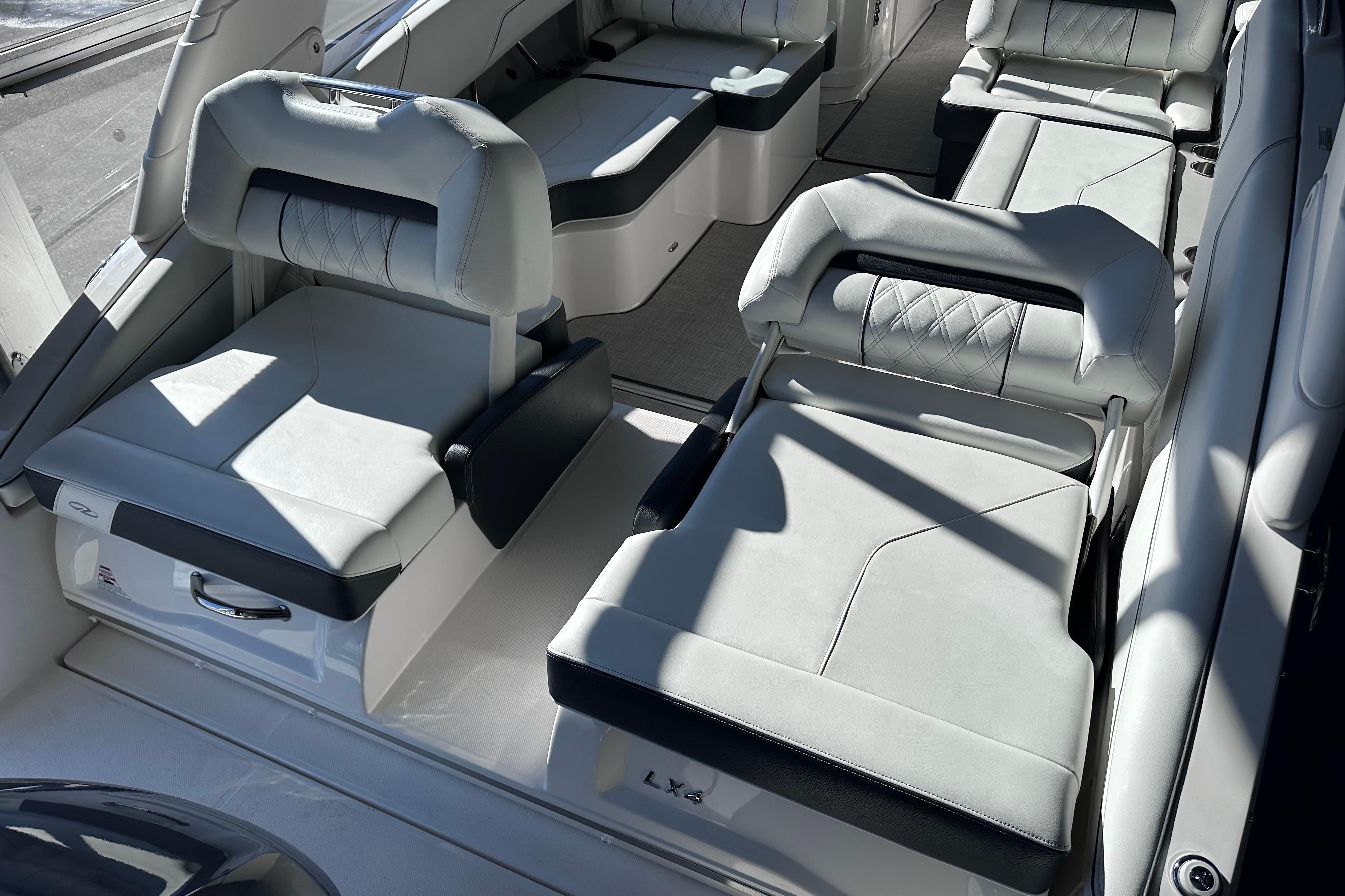 2026 Regal LX4 boat interior with luxurious white seating and modern design.