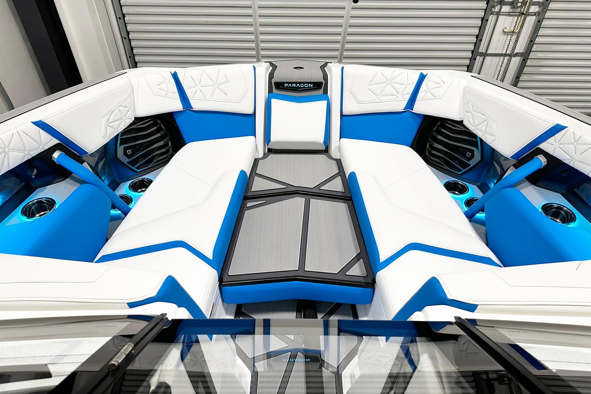 2025 Nautique Super Air Nautique G23 Paragon interior with blue and white seating.