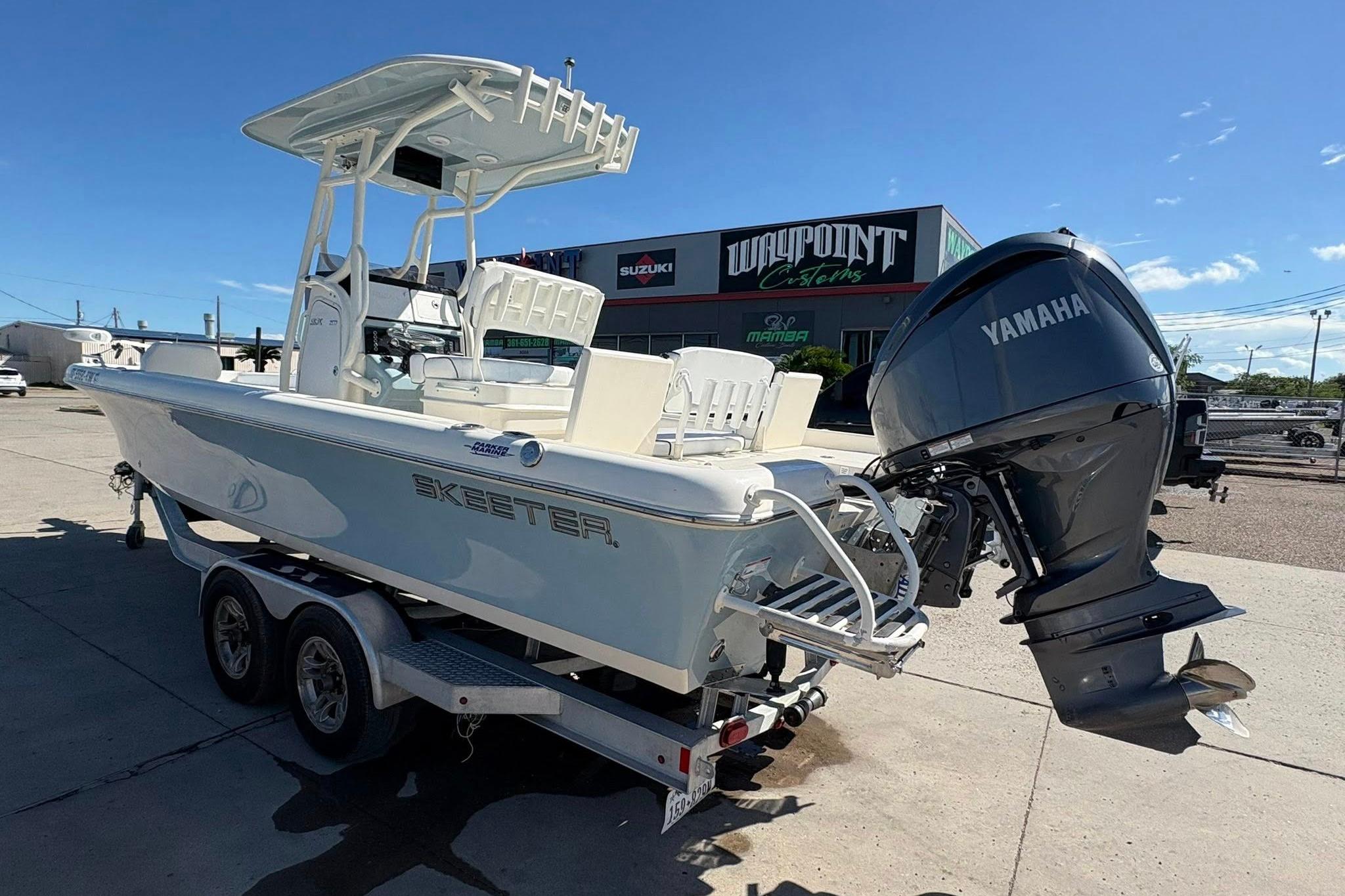 2023 Skeeter SX2550 Family boat with Yamaha outboard motor on trailer.