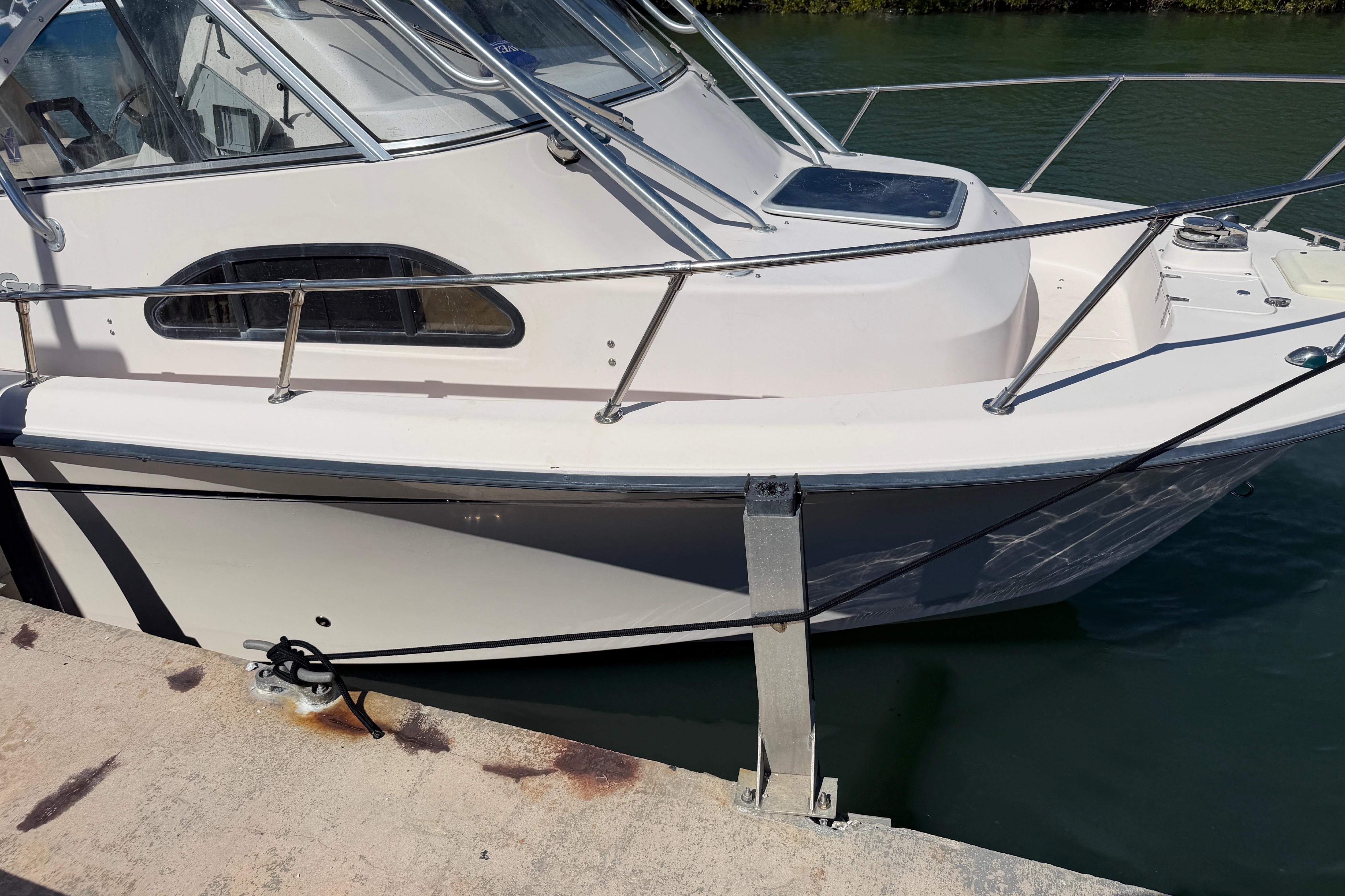 2006 Grady-White Sailfish 282 boat docked at a marina, side view.