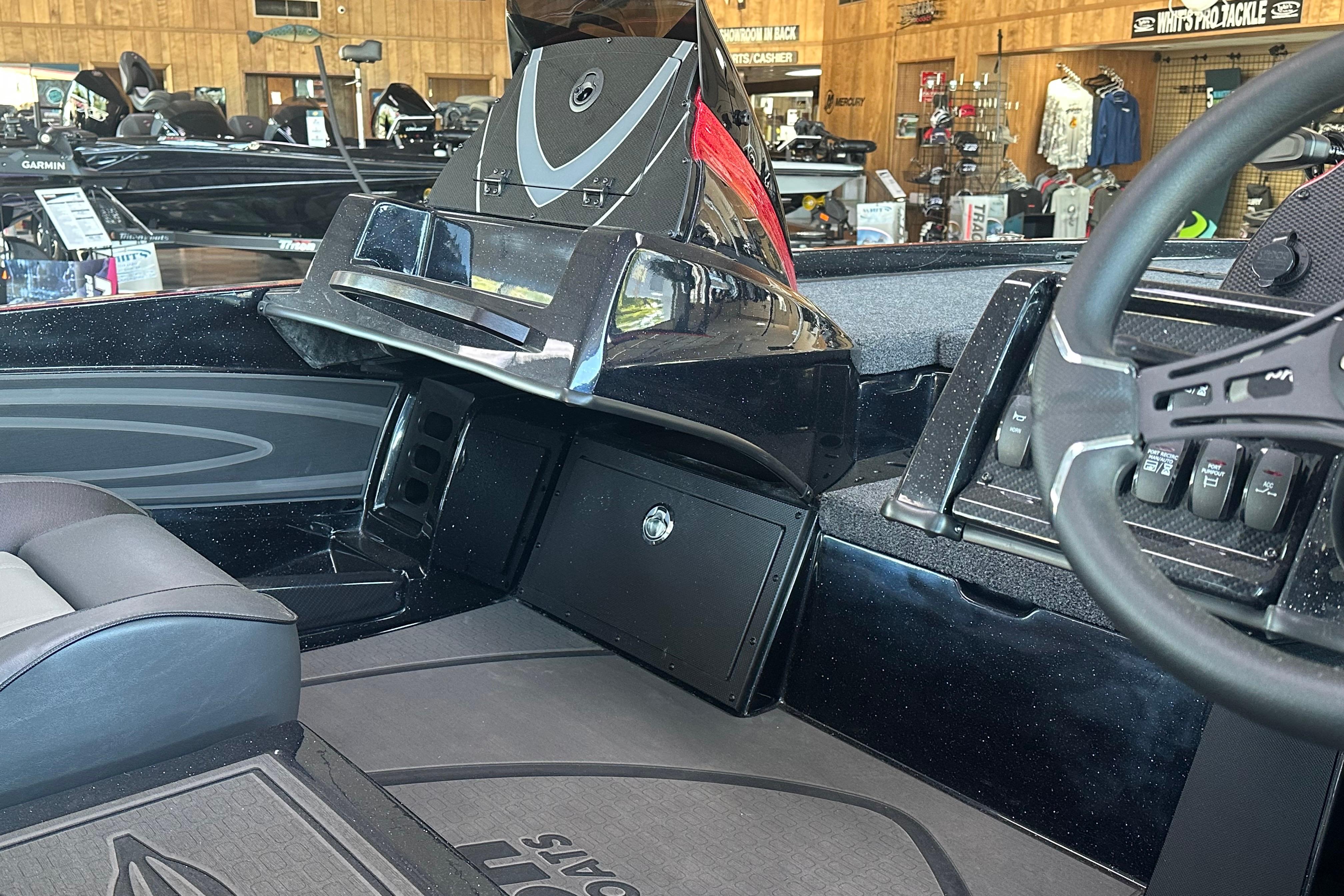 Interior of a 2026 Triton 20XP Patriot boat, showcasing dashboard and seating.