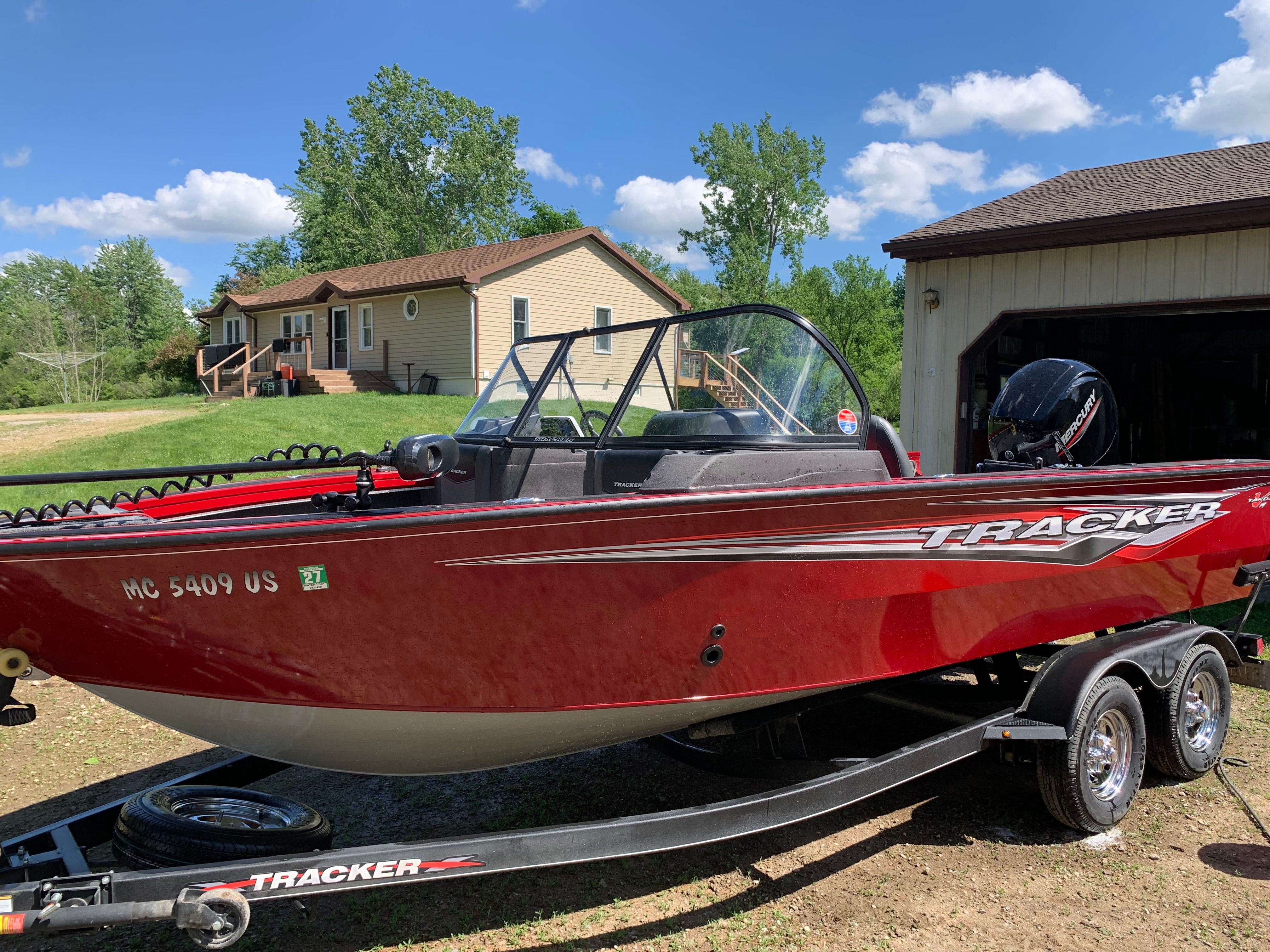 Red Tracker Targa V-19 WT boat on trailer, 2022 model.
