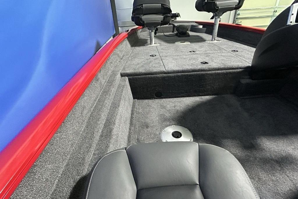 2026 Tracker Pro Team 175 Crappie Edition boat interior with gray seating and carpeted deck.