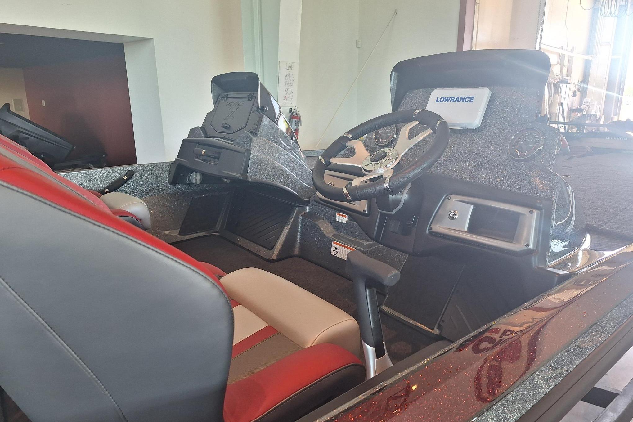 2026 Nitro Z20 XL boat interior with steering wheel and Lowrance electronics.
