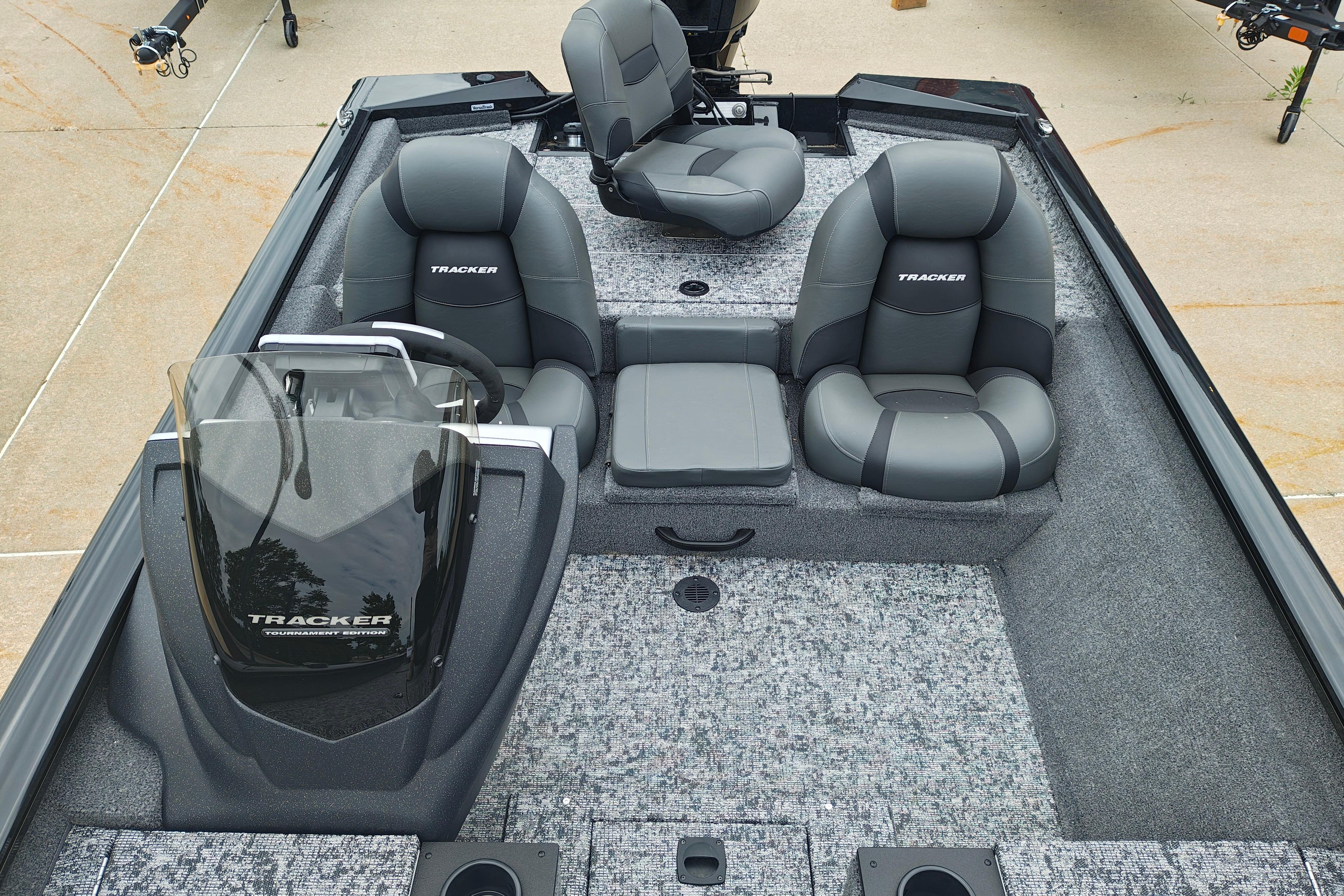 2026 Tracker Pro Team 175 boat interior with gray seating and steering console.