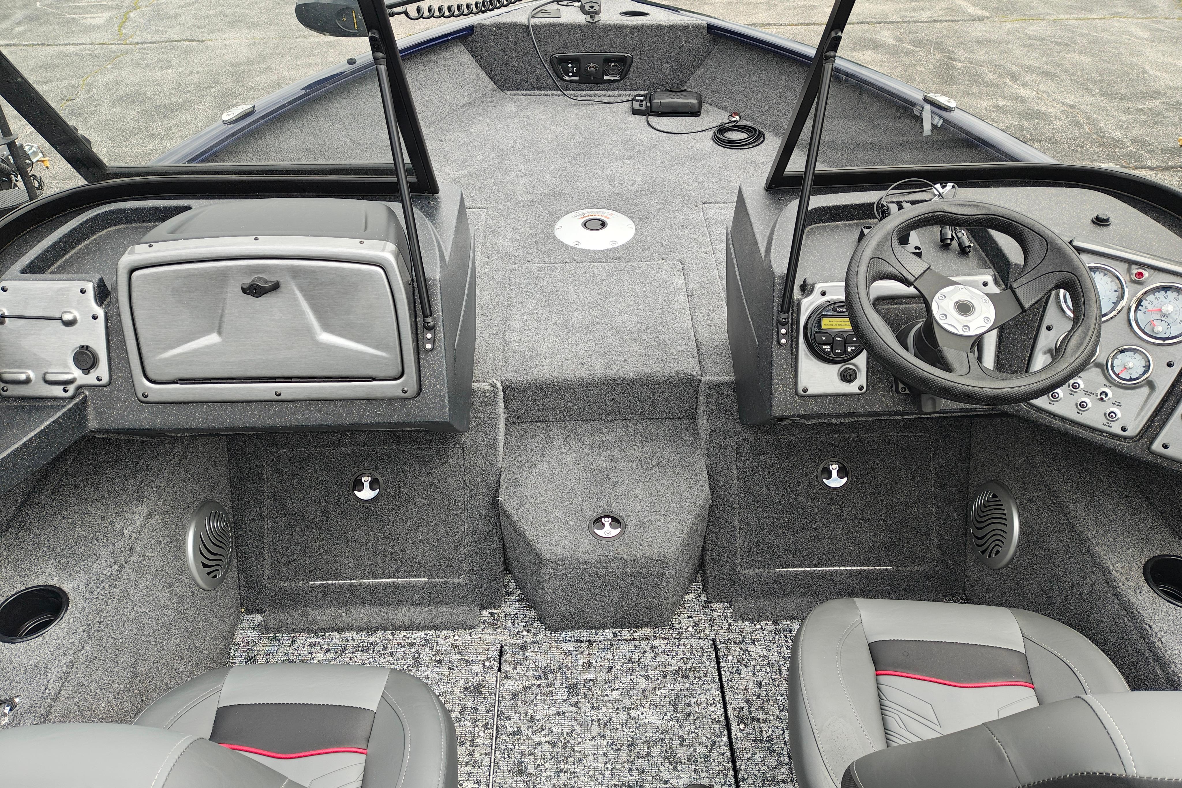 Interior of 2026 Tracker Pro Guide V-175 WT boat, featuring steering console and seating.