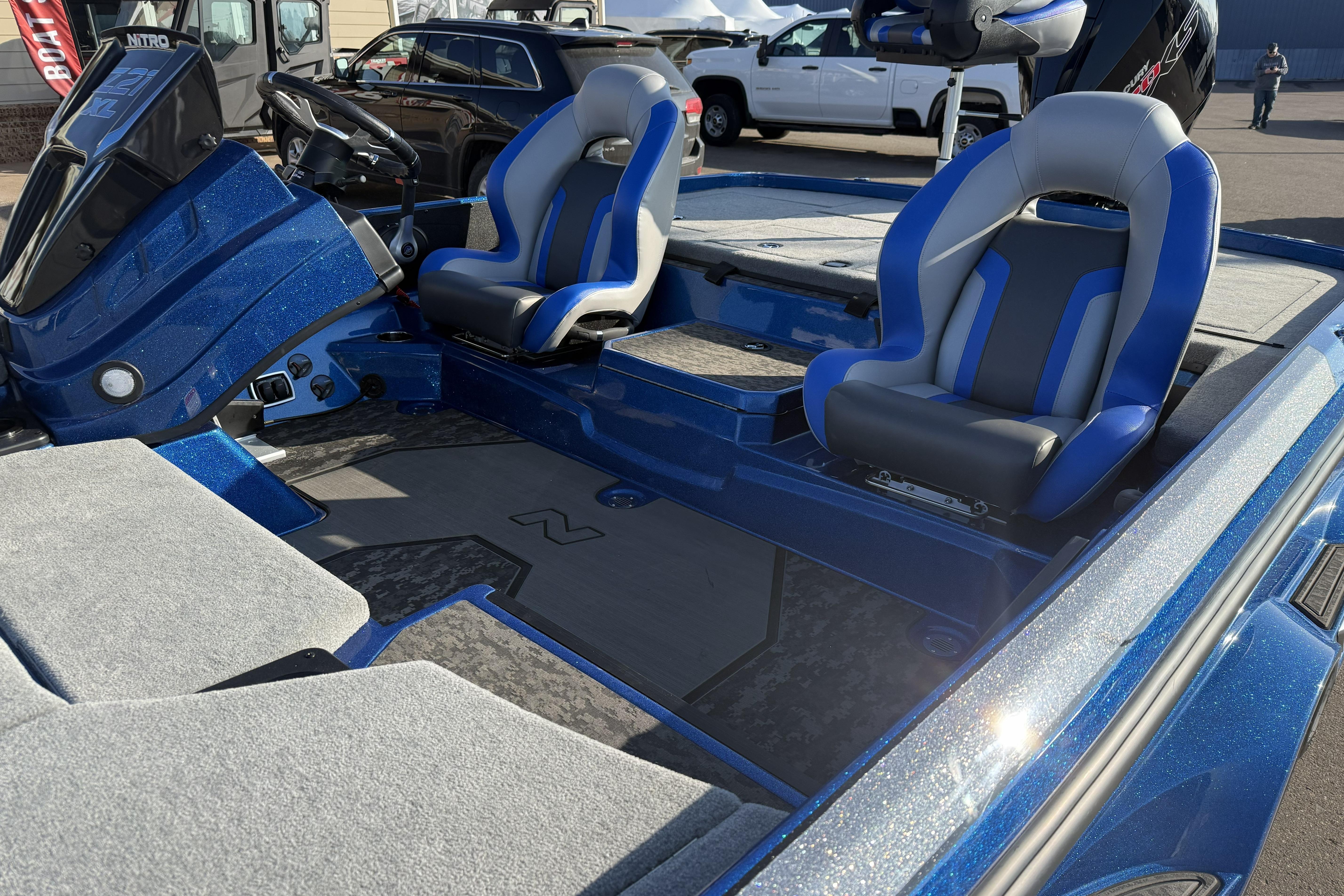 2026 Nitro Z21 XL Pro boat interior with blue and gray seating, showcasing modern design.