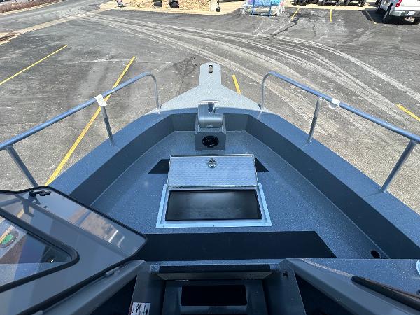 2024 Spartan 260 Maximus Pro XL boat deck with storage compartment.