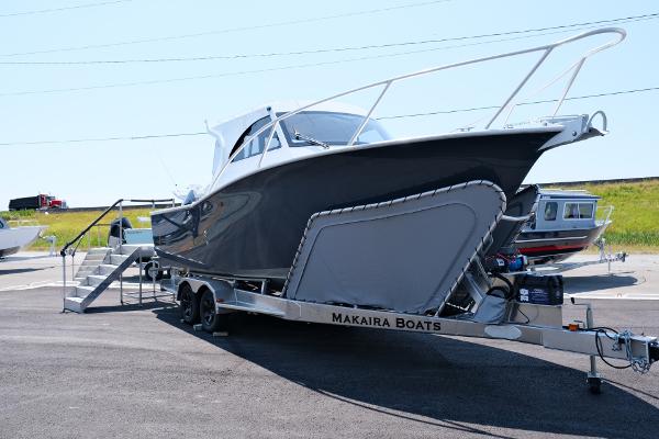 2023 Makaira Gen3 800 boat on trailer, displayed outdoors.