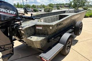 2025 Tracker Grizzly 1650 T Prairie Wings Edition boat on trailer, outdoors.