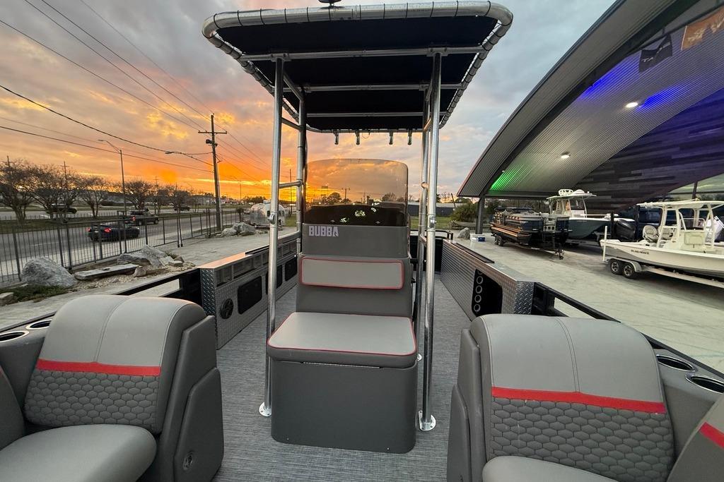 2022 Apex Marine 8524 Pro Fish N Cruise boat at sunset, showcasing seating and helm.