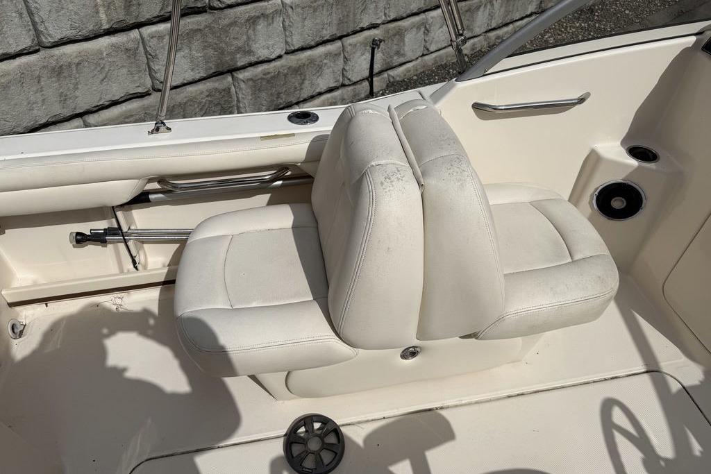 2019 Grady-White Freedom 215 boat interior with white seating and stainless steel accents.