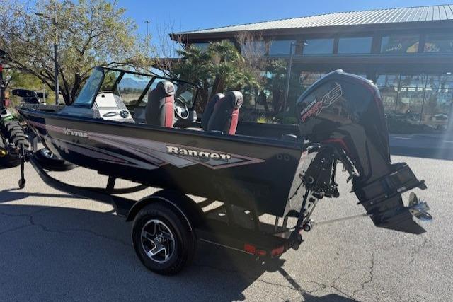 2026 Ranger VS1782SC Angler boat with outboard motor, parked outdoors.